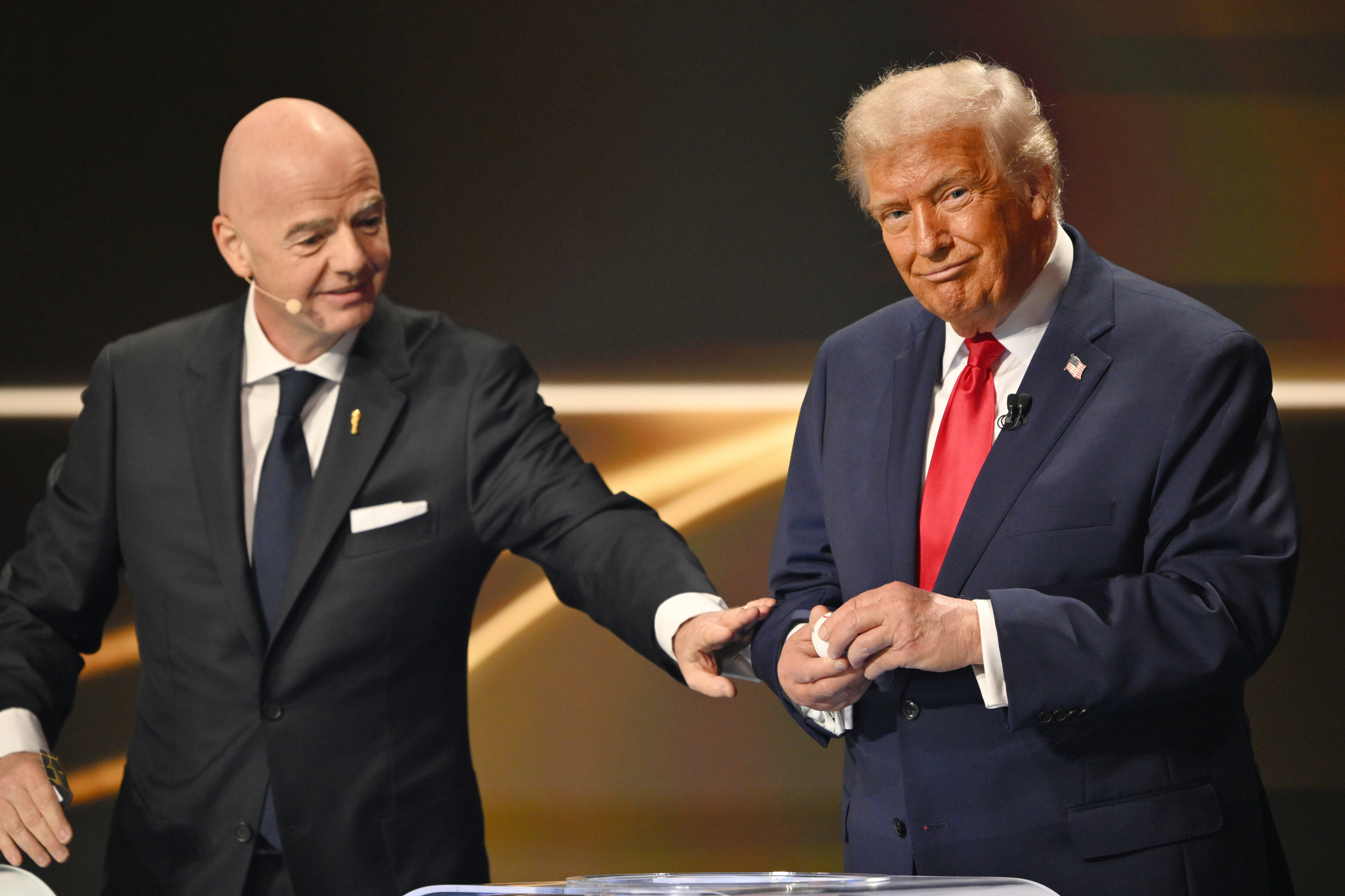 FIFA President Gianni Infantino pauses President Donald Trump during the draw for the 2026 soccer World Cup