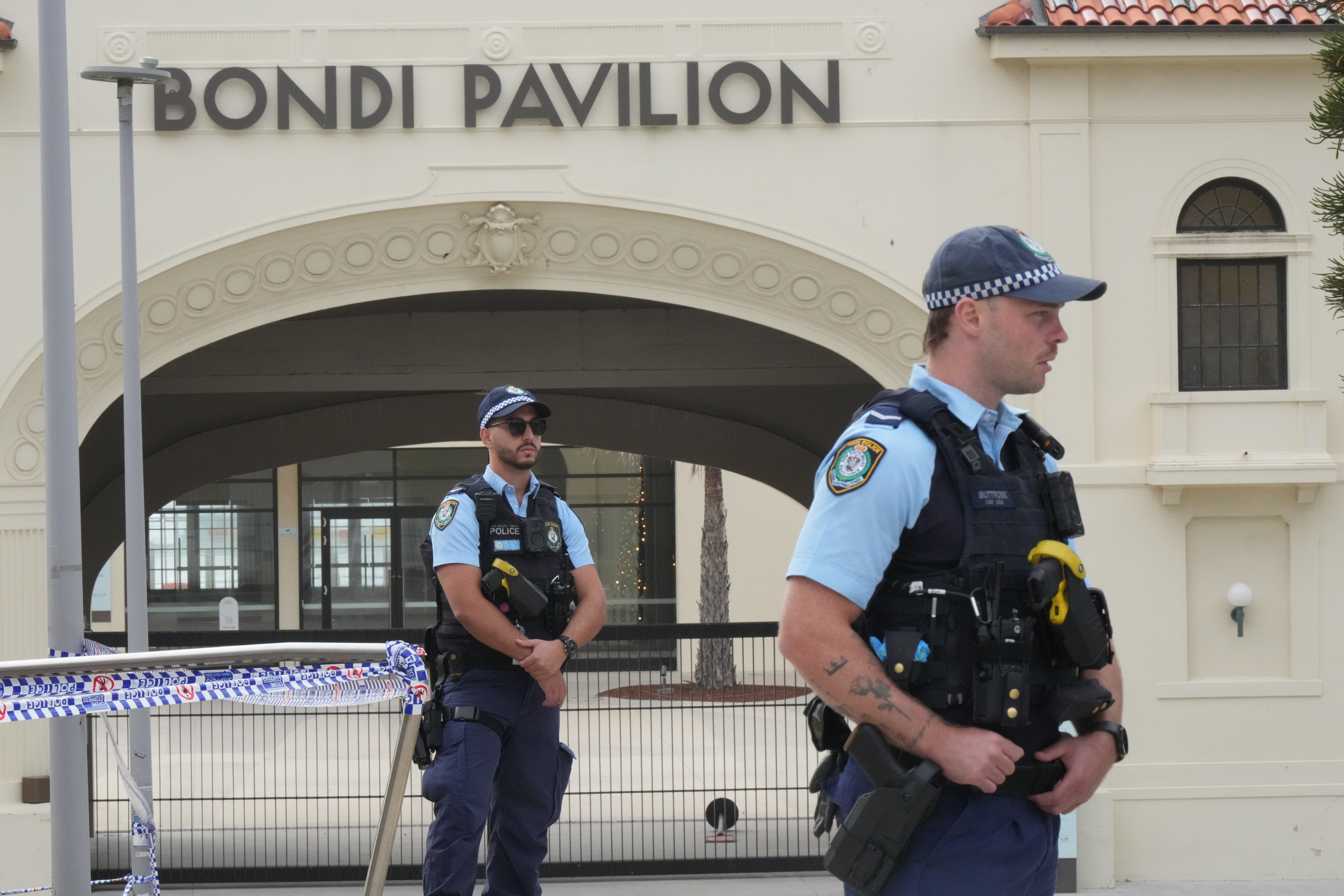 Police patrol in the early morning following a shooting Sunday at Sydney's Bondi Beach, Monday, Dec. 15, 2025. (AP Photo/Mark Baker)