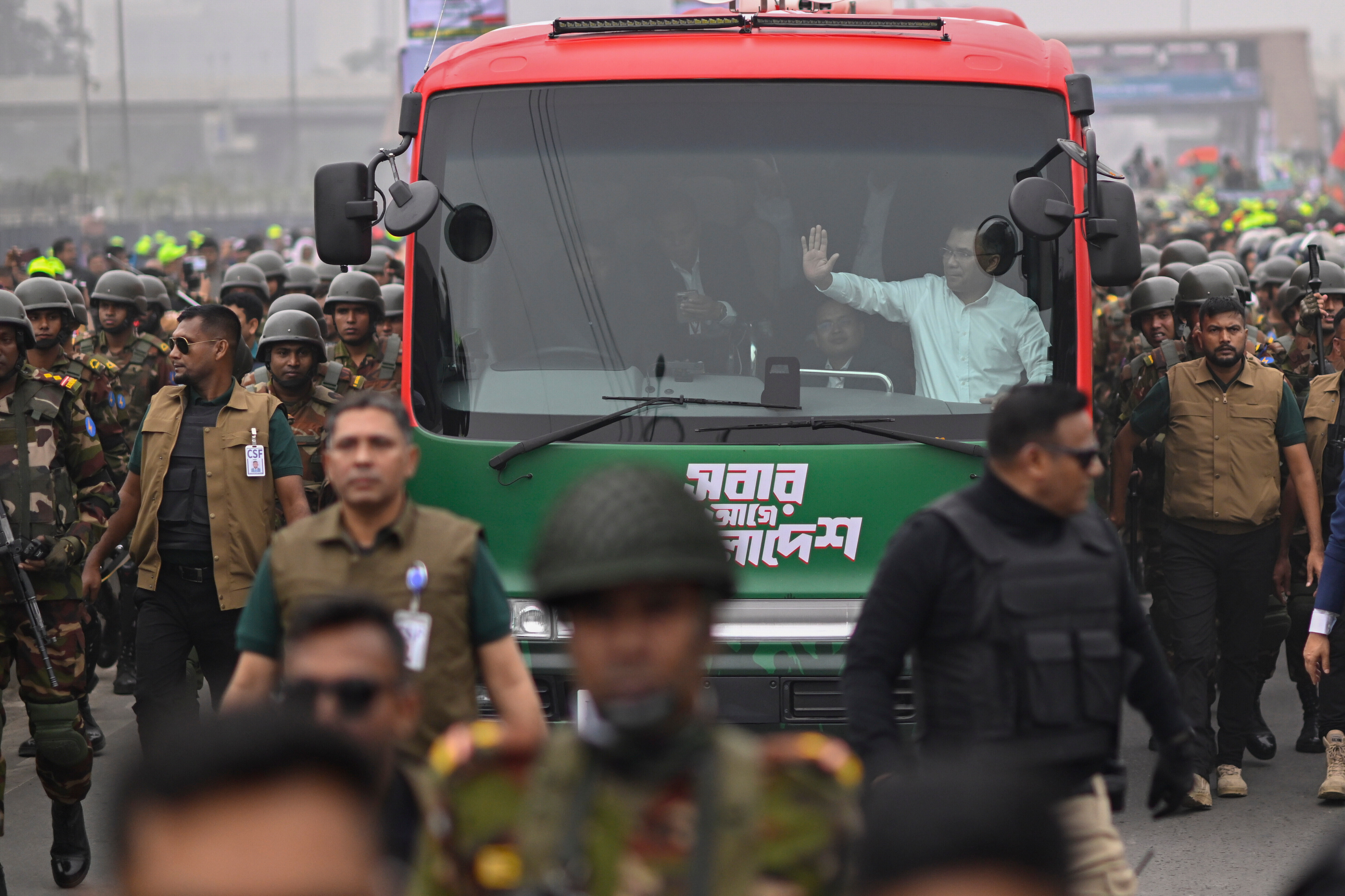 Bangladesh Nationalist Party (BNP) Acting Chairman Tarique Rahman waves to supporters from a bus in Dhaka after returning from London, ending more than 17 years of self-imposed exile, Thursday, Dec. 25, 2025.(AP Photo/Mahmud Hossain Opu)