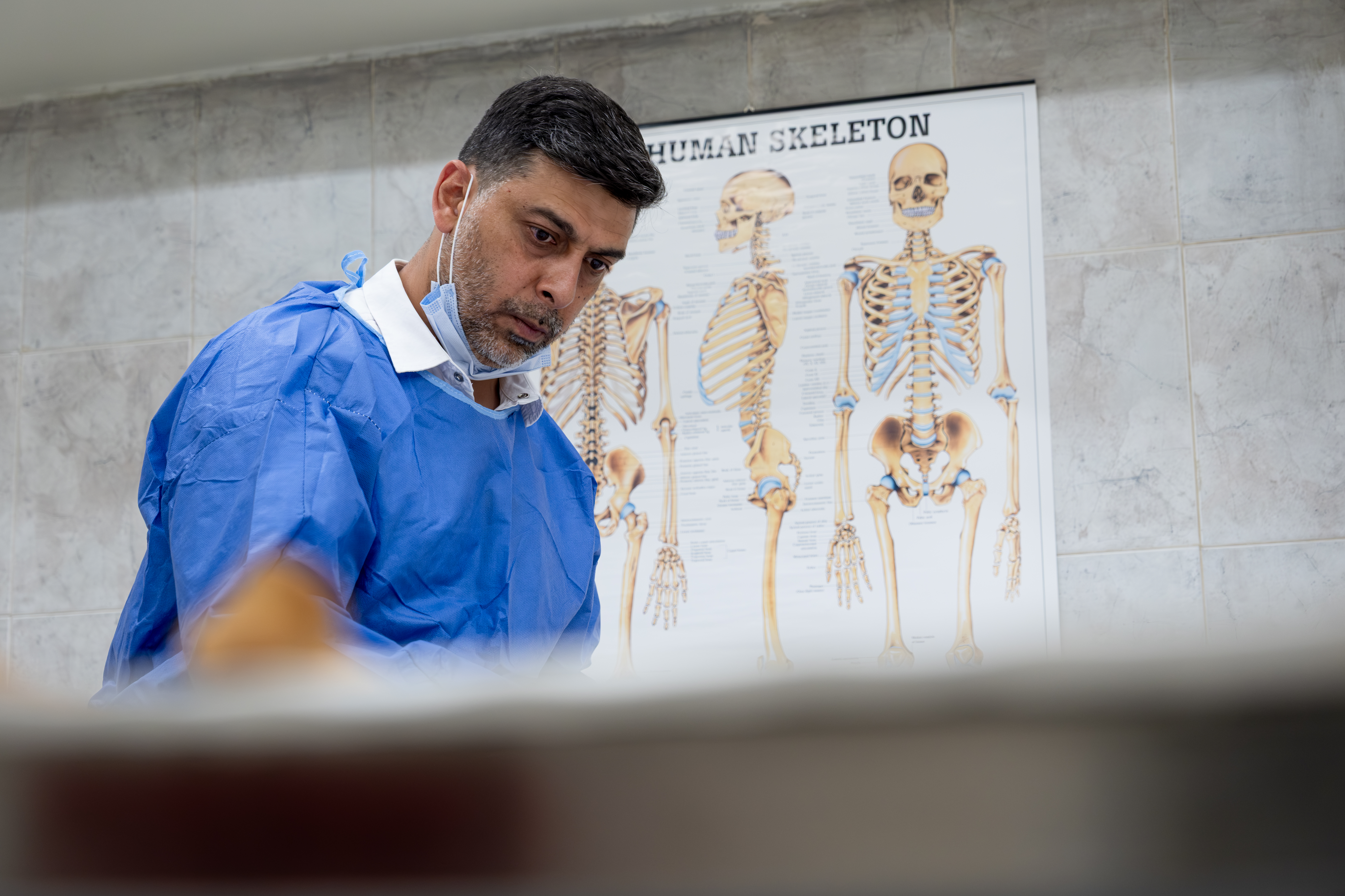  Dr Anas Al Hourani is a forensic odontologist - meaning he studies teeth to help identify a person's remains. [Harriet Tatham/Al Jazeera]