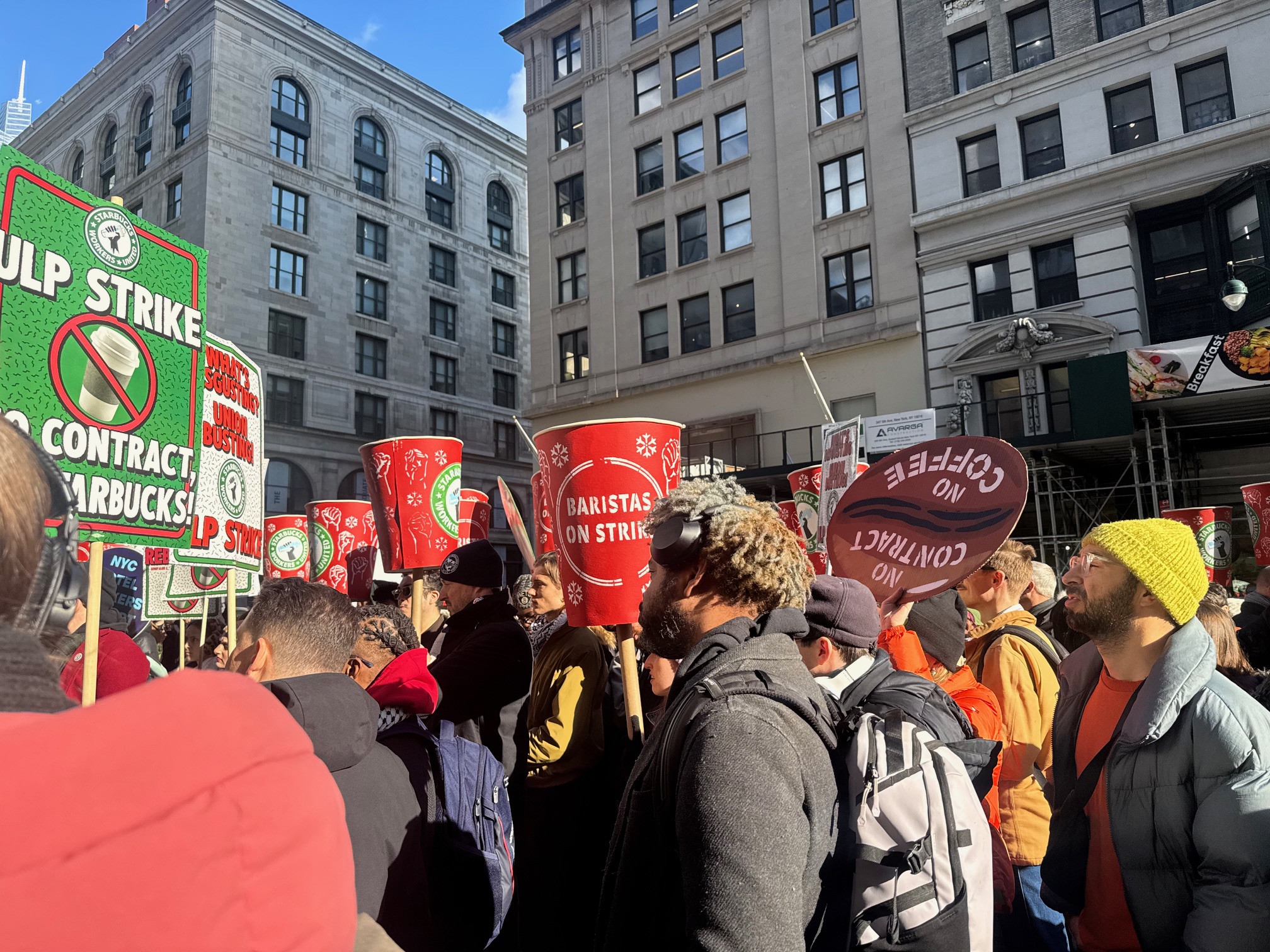 Picketers lined New York’s Fifth Avenue calling for better working conditions at Starbucks [Andy Hirschfeld/Al Jazeera]