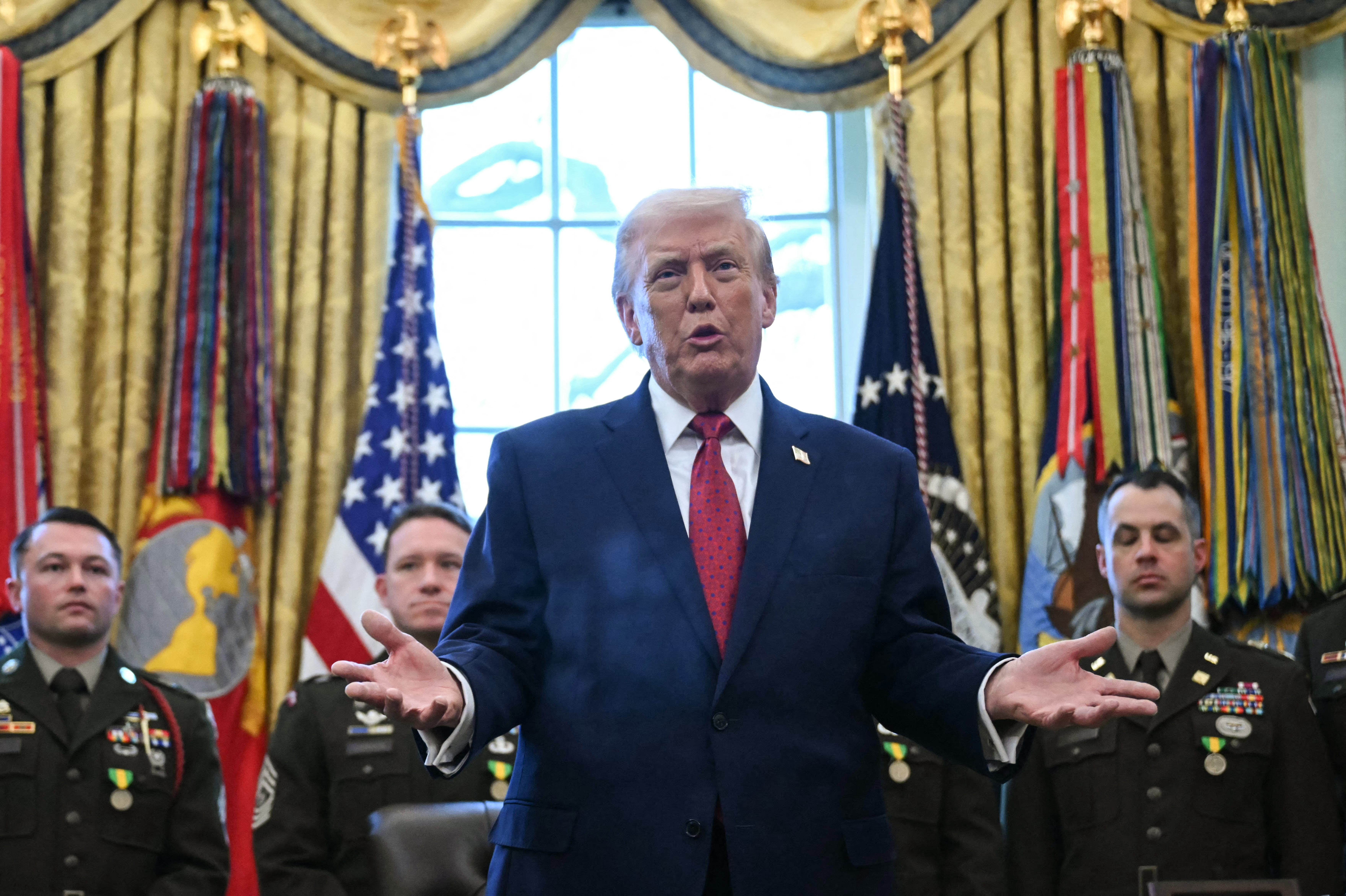 US President Donald Trump speaks during a Mexican Border Defense Medal presentation in the Oval Office of the White House in Washington, DC, on December 15, 2025. (Photo by ANDREW CABALLERO-REYNOLDS / AFP)