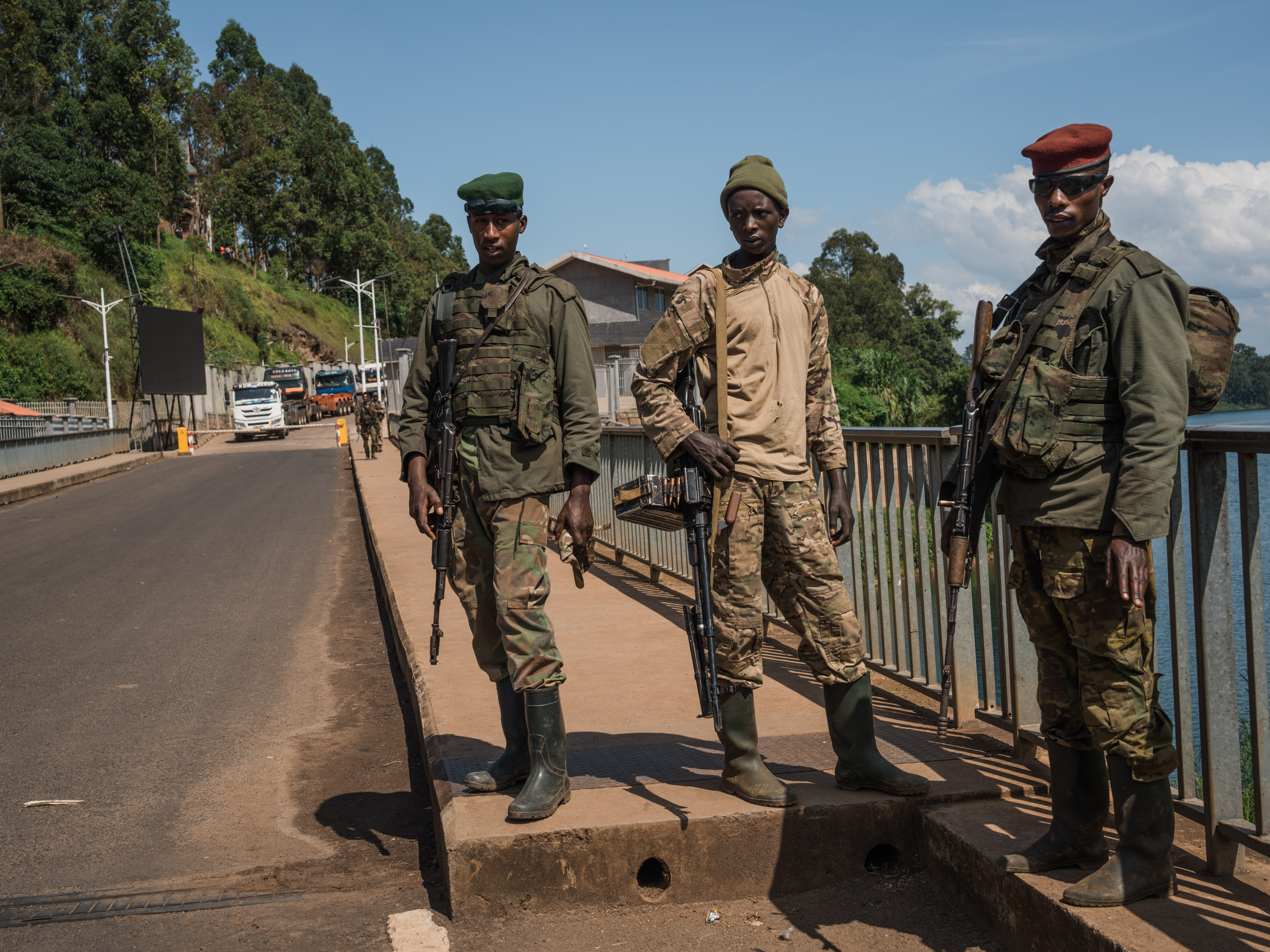 CYANGUGU, RWANDA - FEBRUARY 16: M23 rebel troops arrive at the Rusizi border post joining the Congolese city of Bukavu with Cyangugu in Rwanda, on February 16, 2025 in Cyangugu, Rwanda. Militants from the Rwandan-backed M23 rebel group have entered Bukavu, the capital city of South Kivu province in the Democratic Republic of Congo (DRC). The city with a population of approximately one million people borders Rwanda on the southern end of Lake Kivu, positioned along a key trade route for the mineral-rich region. Hundreds of thousands of people in the eastern part of the DRC have been displaced as the rebel group has made swift advances against Congolese pro-government forces in recent weeks. (Photo by Hugh Kinsella Cunningham/Getty Images)