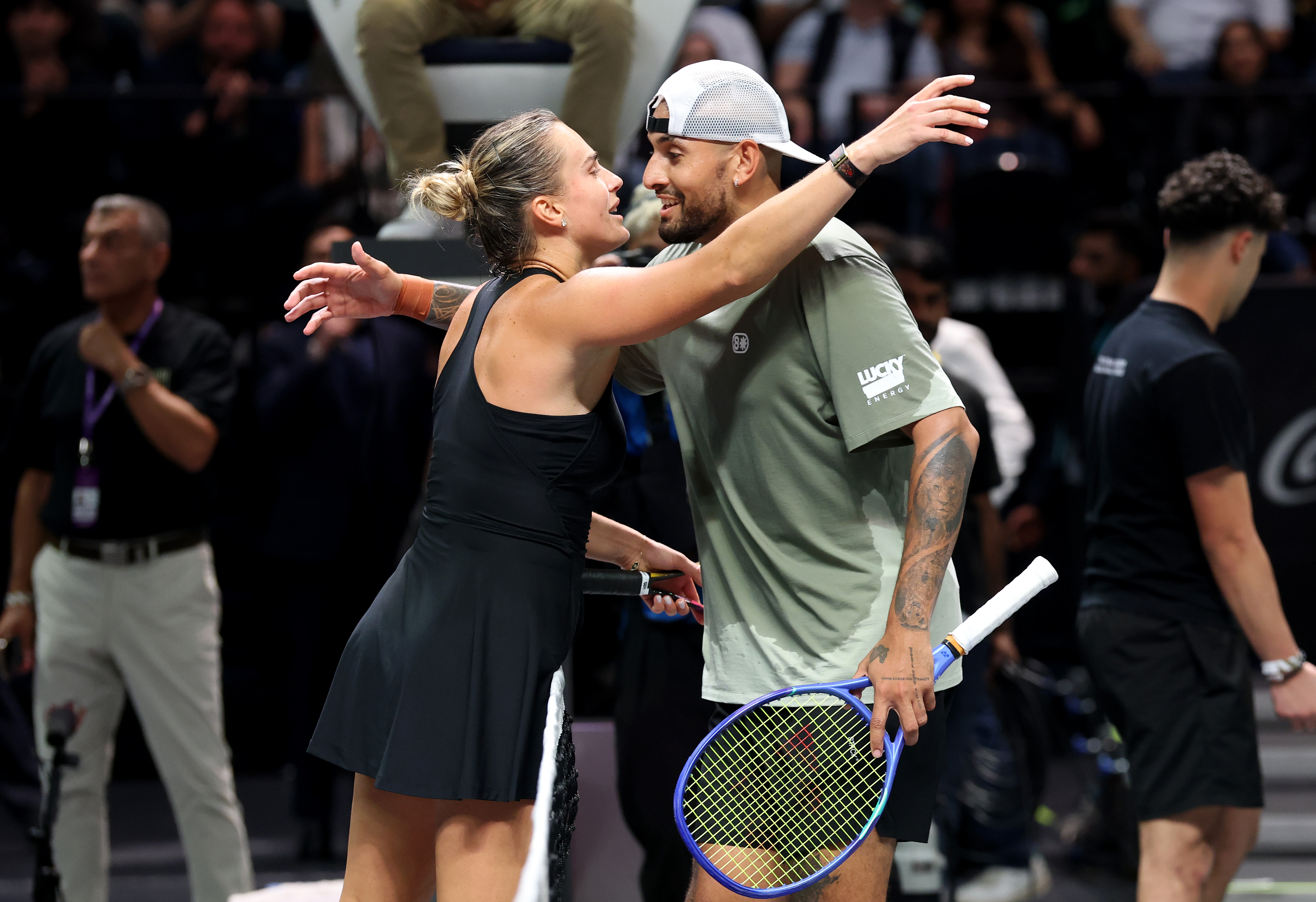 DUBAI, UNITED ARAB EMIRATES - DECEMBER 28: Aryna Sabalenka and Nick Kyrgios of Australia embrace at the net after the Battle of the Sexes match between Aryna Sabalenka and Nick Kyrgios of Australia at Coca-Cola Arena on December 28, 2025 in Dubai, United Arab Emirates. (Photo by Christopher Pike/Getty Images)