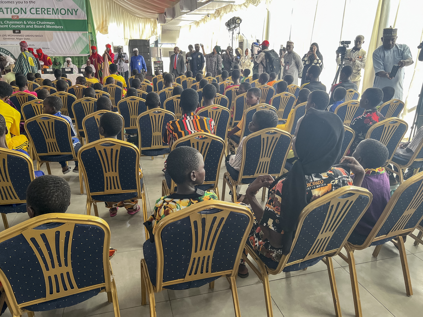 Children, who were released after being kidnapped last month, sit in a hall upon their arrival at the Niger State Government House in Minna on Dec. 22, 2025. Some 130 Nigerian Catholic school pupils were handed over to state authorities on December 22, 2025, a day after the government said it had secured their release a month after one of the country's worst mass abductions. Kidnappings for ransom are a common way for armed groups to make quick cash in the conflict-hit west African nation of some 230 million, but a spate of attacks in November put an uncomfortable international spotlight on Nigeria's grim security situation. [ Audu Abba Kurama/AFP]