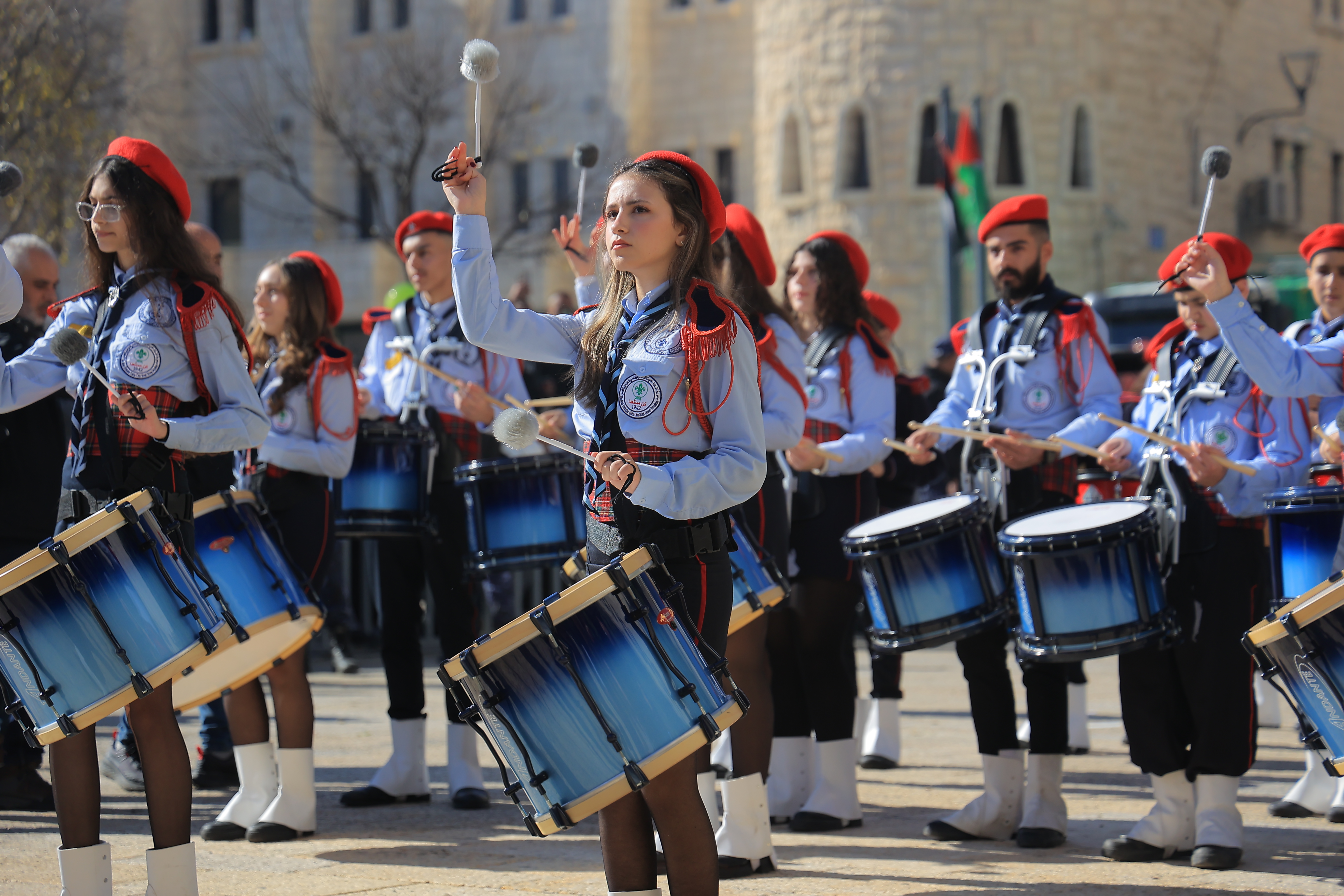 Palestinian young women play drums