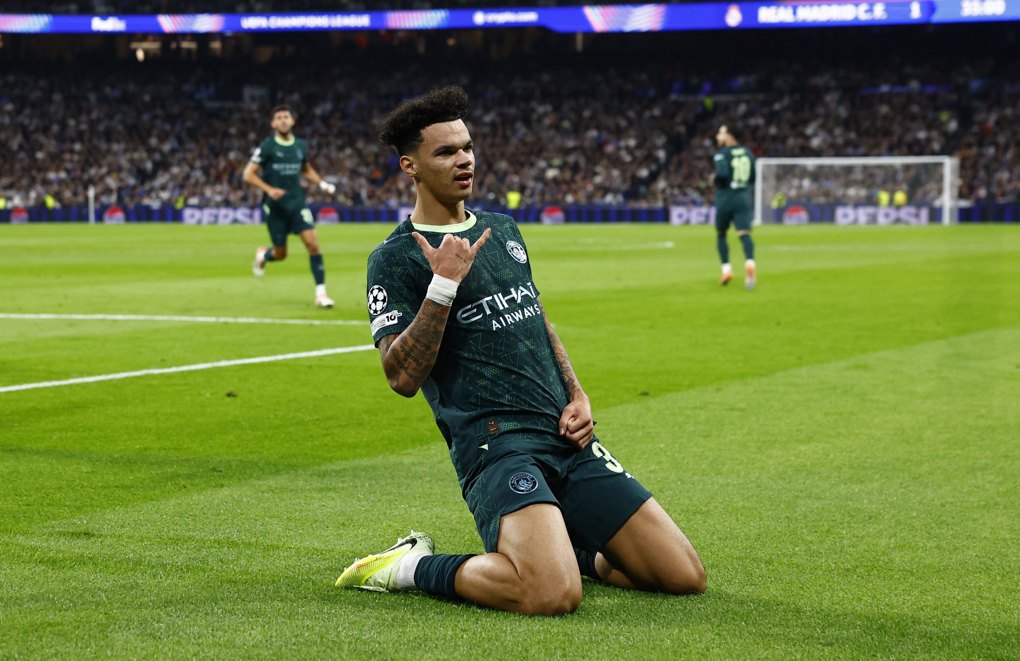 Soccer Football - UEFA Champions League - Real Madrid v Manchester City - Santiago Bernabeu, Madrid, Spain - December 10, 2025 Manchester City's Nico O'Reilly celebrates scoring their first goal REUTERS/Susana Vera