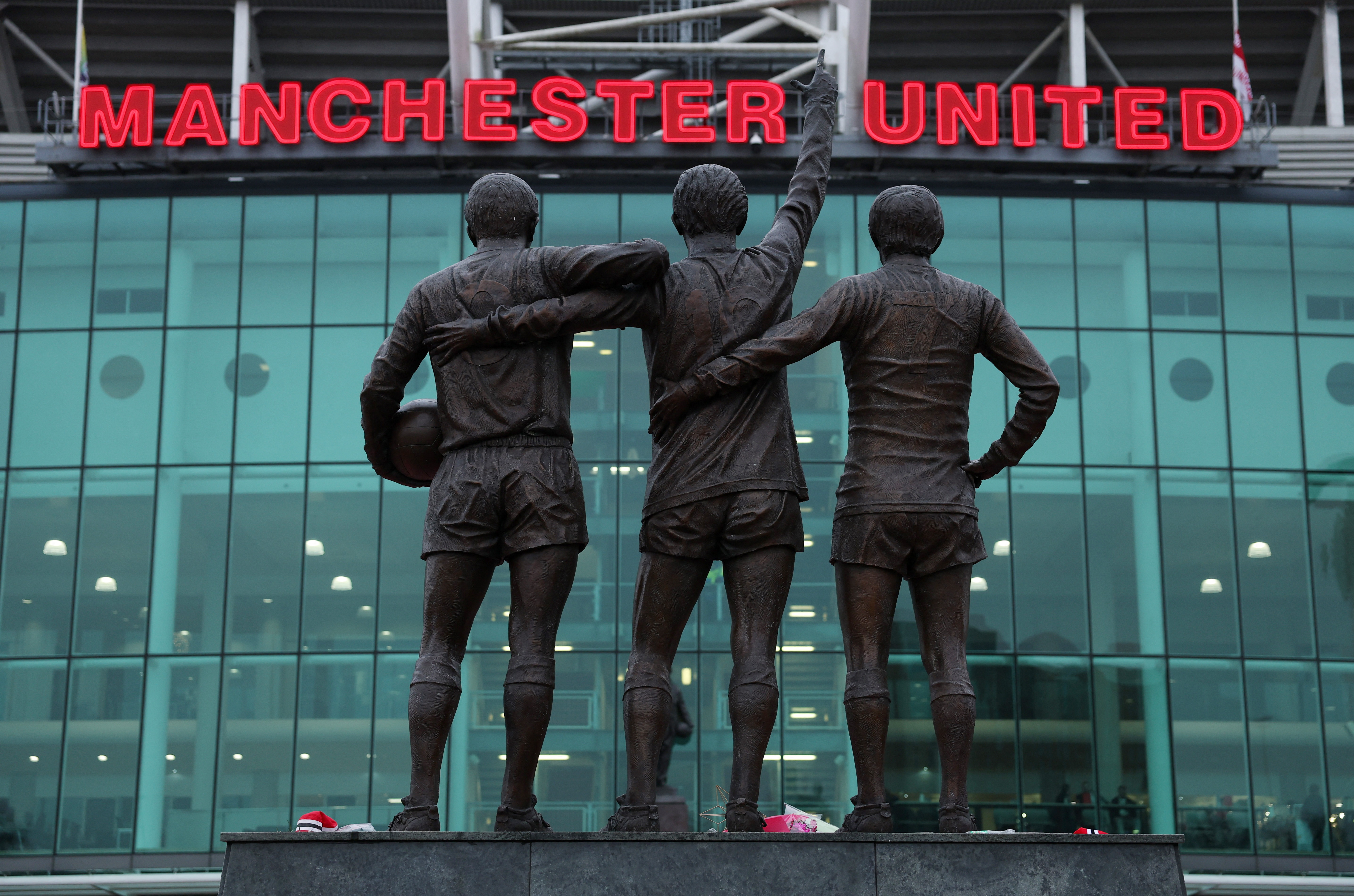 Soccer Football - Premier League - Manchester United v Brighton & Hove Albion - Old Trafford, Manchester, Britain - January 19, 2025 General view of the trinity statue of Bobby Charlton, Denis Law and George Best outside the stadium before the match REUTERS/Phil Noble EDITORIAL USE ONLY. NO USE WITH UNAUTHORIZED AUDIO, VIDEO, DATA, FIXTURE LISTS, CLUB/LEAGUE LOGOS OR 'LIVE' SERVICES. ONLINE IN-MATCH USE LIMITED TO 120 IMAGES, NO VIDEO EMULATION. NO USE IN BETTING, GAMES OR SINGLE CLUB/LEAGUE/PLAYER PUBLICATIONS. PLEASE CONTACT YOUR ACCOUNT REPRESENTATIVE FOR FURTHER DETAILS..