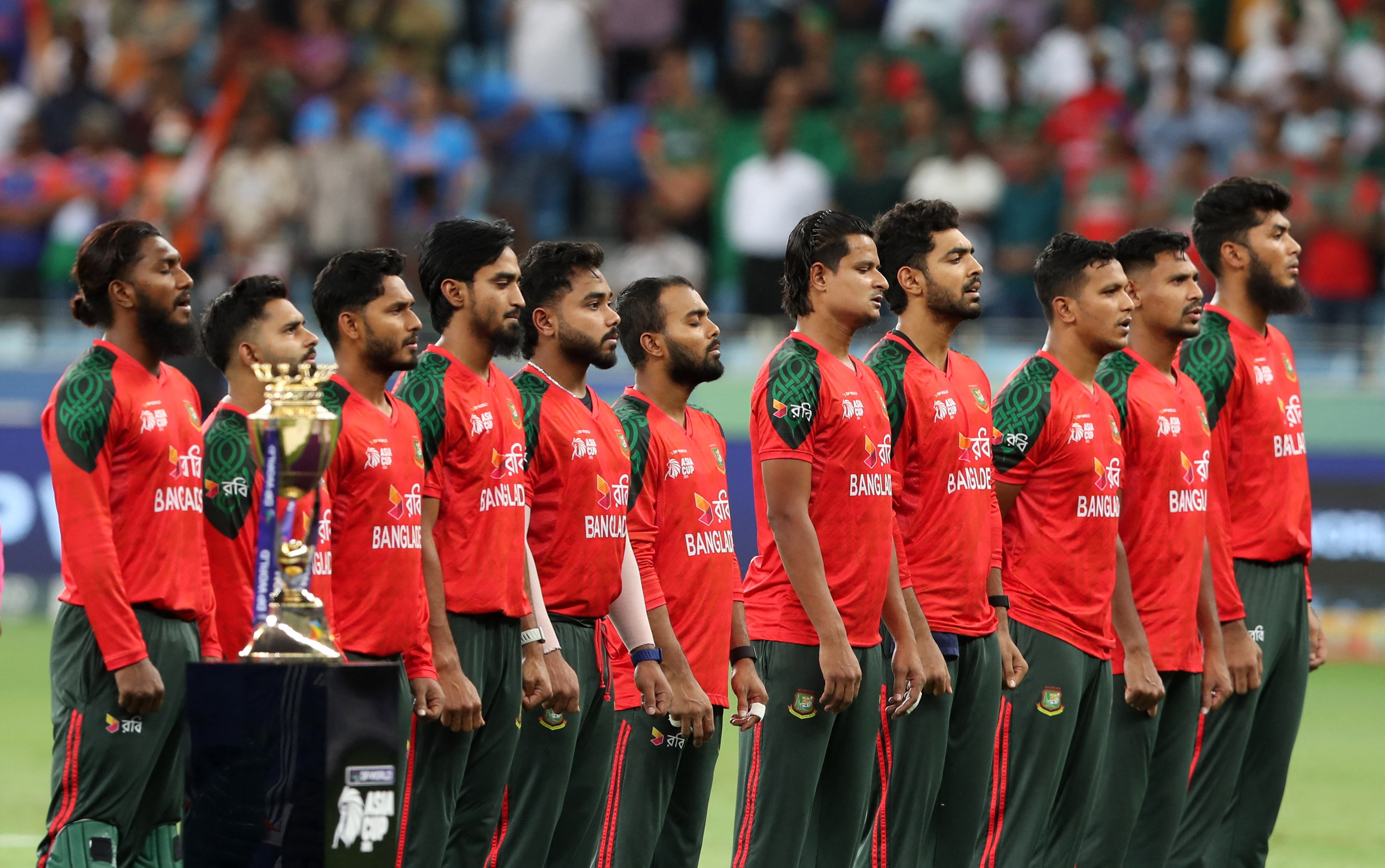 General view of the trophy as the Bangladesh players line up during the national anthems before the match.