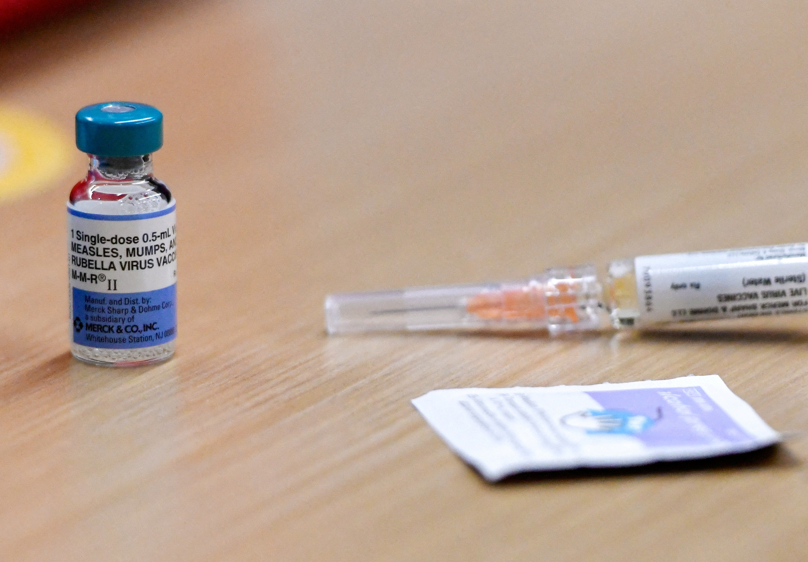 A measles vaccine and syringe