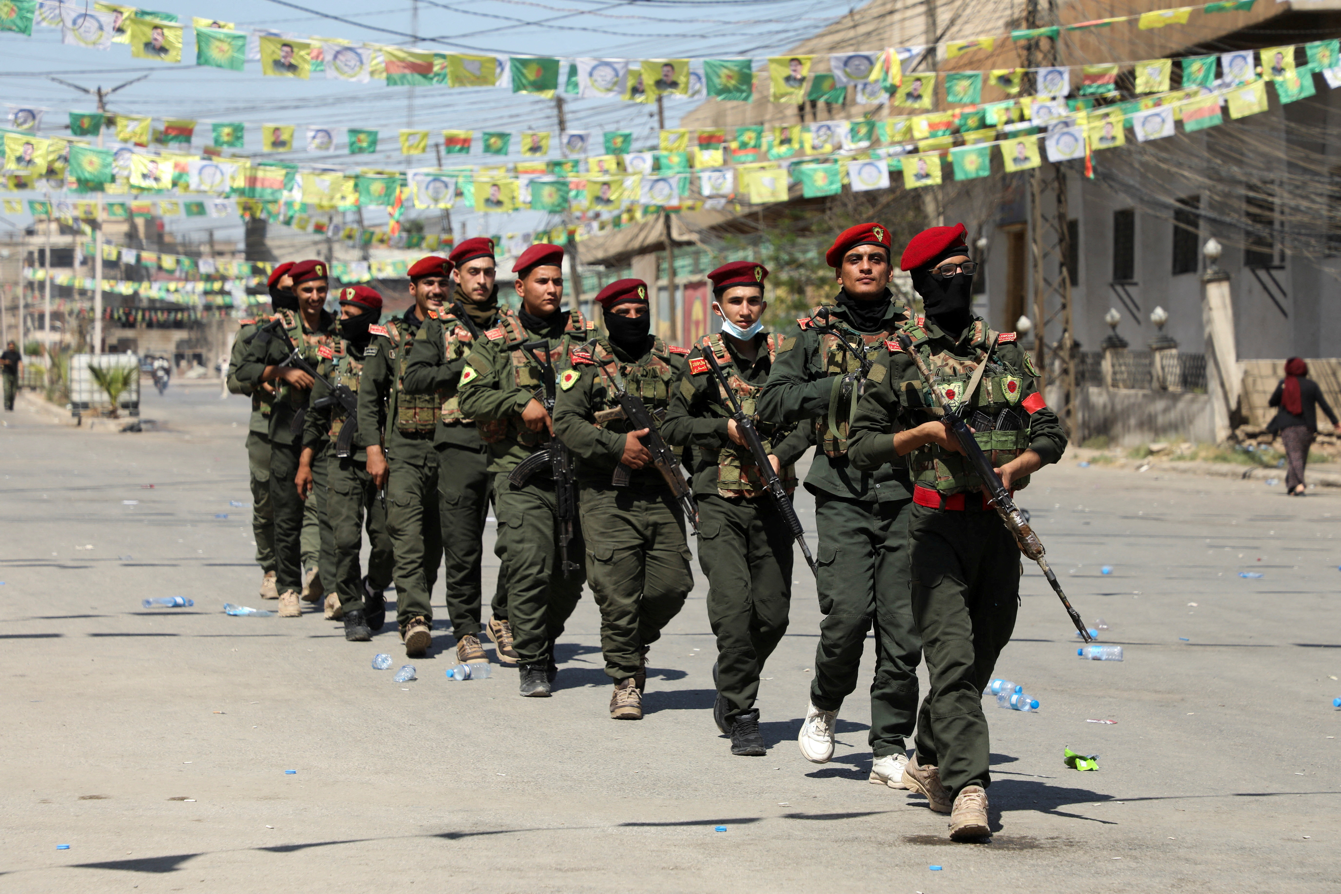 FILE PHOTO: Armed members of the Syrian Democratic Forces' (SDF) military police take part in a demonstration under the banner “With our will, we will protect our revolution”, in Qamishli, Syria, September 17, 2025. REUTERS/Orhan Qereman/File Photo