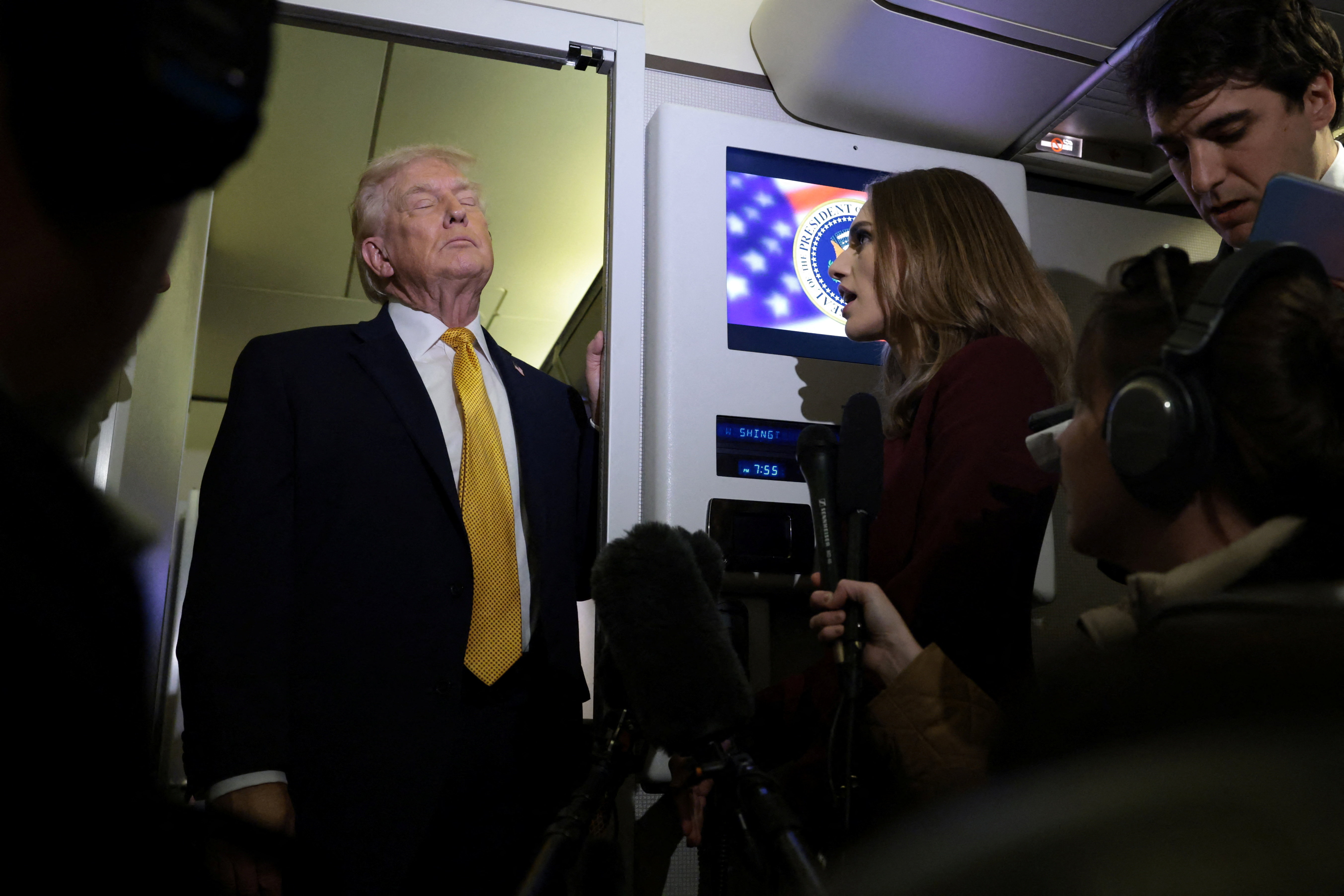 U.S. President Donald Trump pauses before answering a reporter’s question aboard Air Force One en route from Florida to Joint Base Andrews, Maryland, U.S., January 4, 2026. REUTERS/Jonathan Ernst