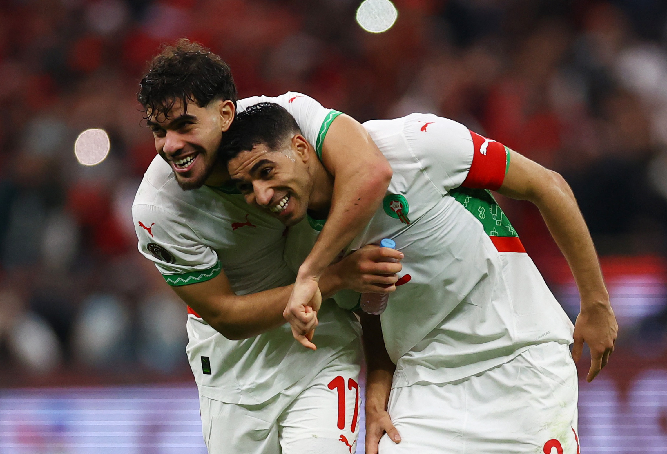 Morocco's Achraf Hakimi and Morocco's Abde Ezzalzouli celebrate after the match
