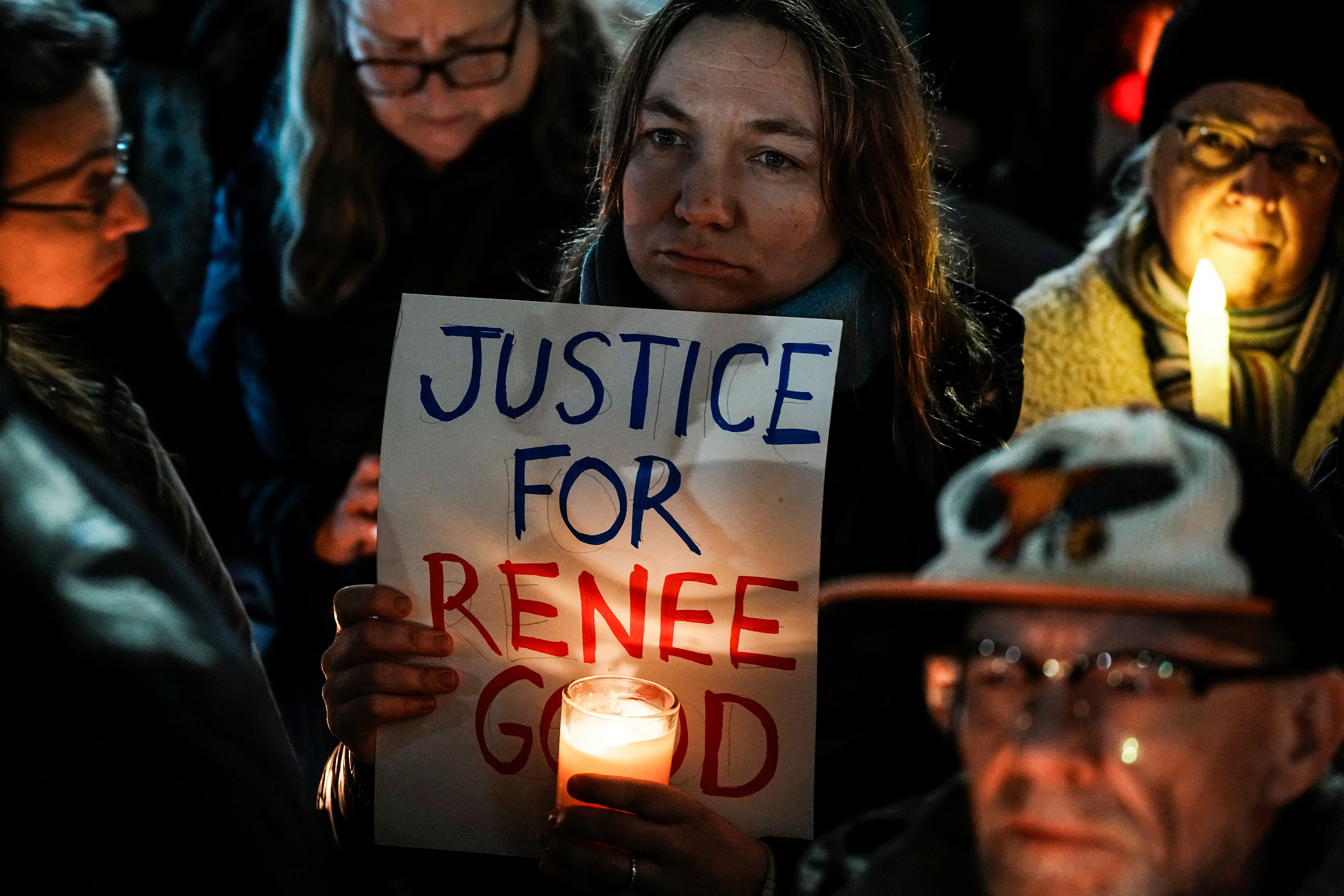 A protester holds up a sign that reads, "Justice for Renee"
