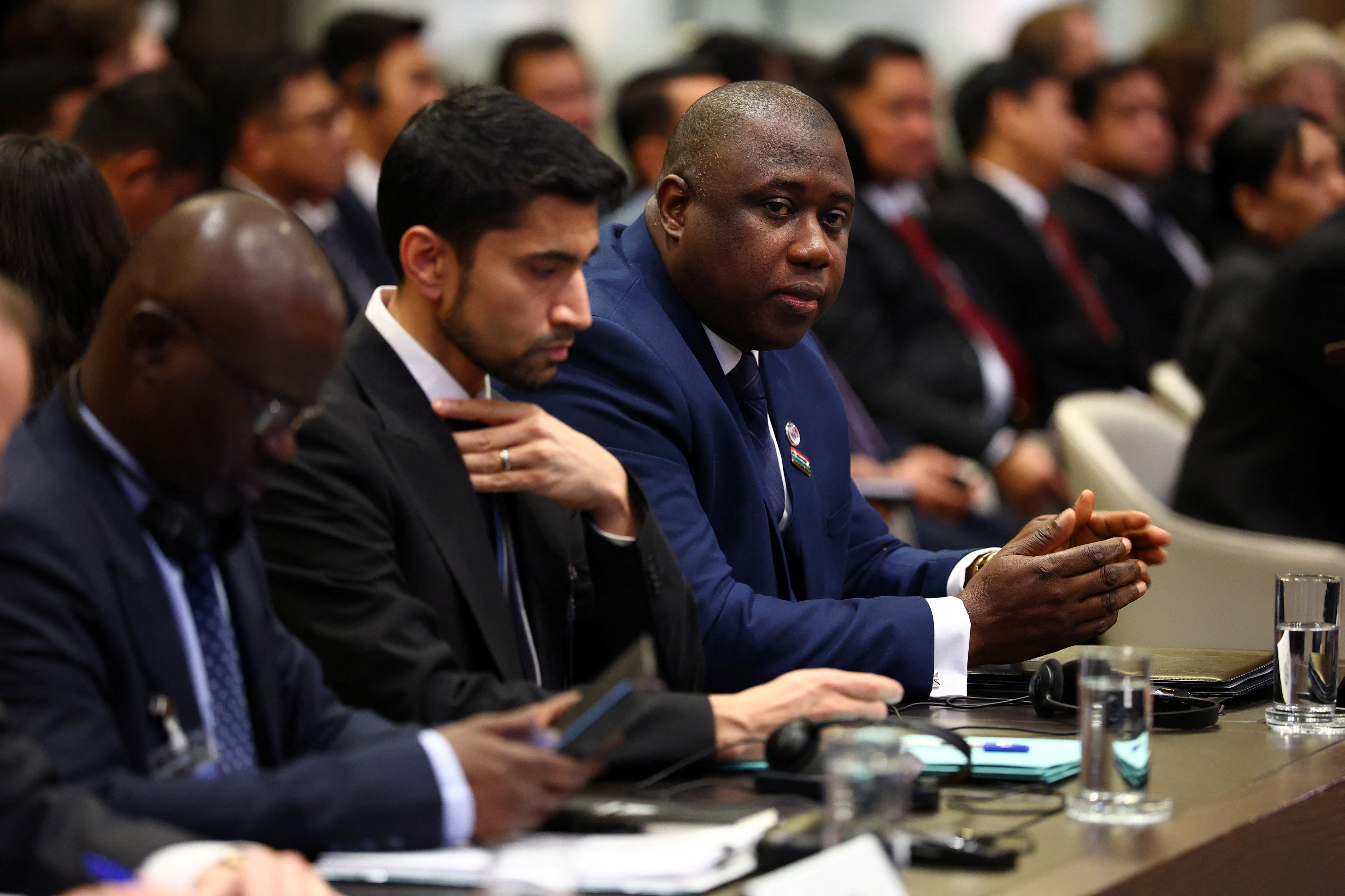 Gambian Justice Minister and Attorney General Dawda Jallow sits in the courtroom, next to lawyer Arsalan Suleman, as the International Court of Justice (ICJ) starts hearings in a landmark case brought by The Gambia, which accuses Myanmar of committing genocide against the Rohingya, a minority Muslim group, in The Hague, Netherlands, on January 12, 2026 [Piroschka van de Wouw/Reuters]
