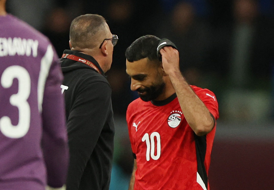 Liverpool and Egypt forward Mohamed Salah looks dejected on the field.