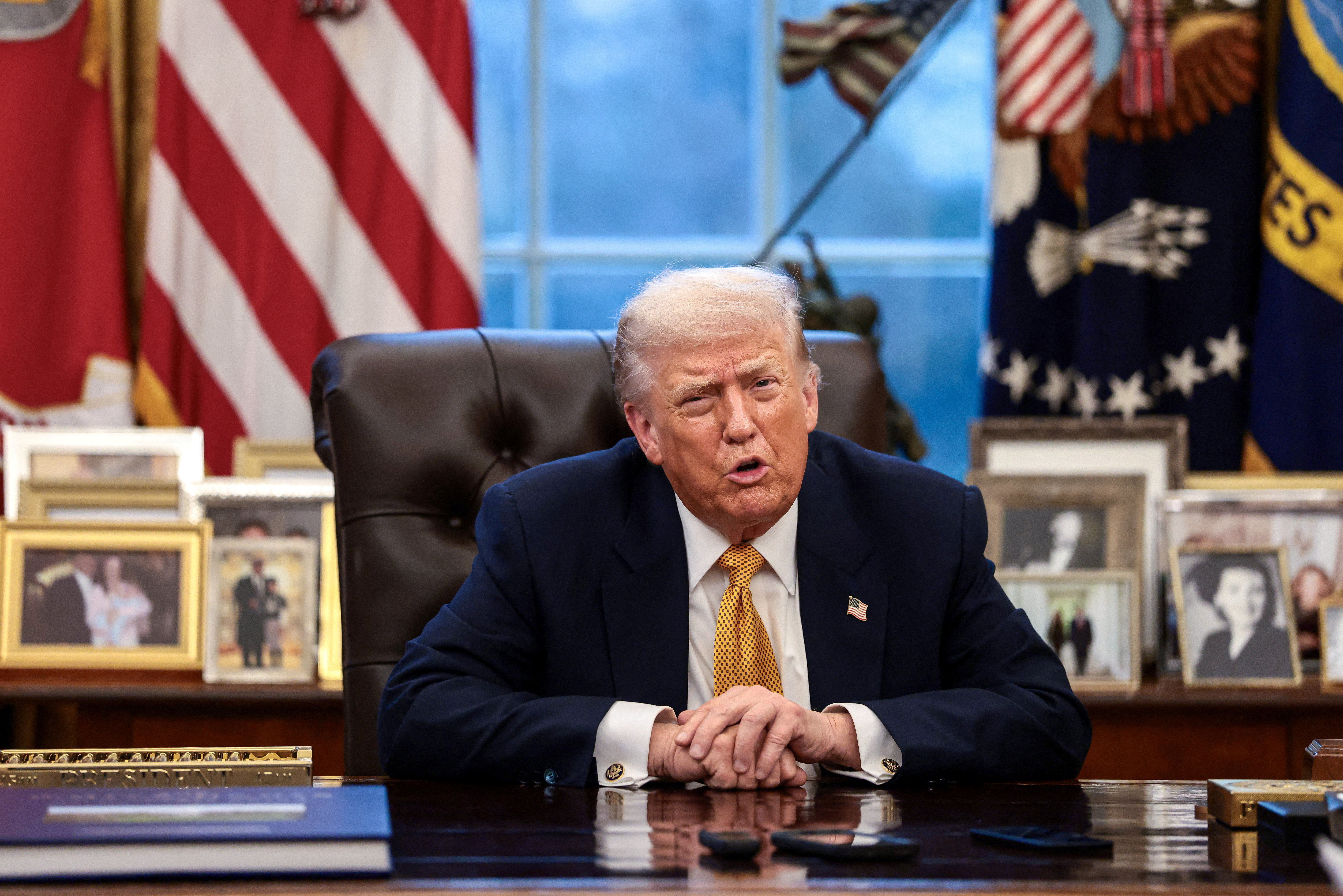 US President Donald Trump is interviewed by Reuters White House correspondent Steve Holland (not pictured) during an exclusive interview in the Oval Office at the White House in Washington, DC on January 14, 2026.