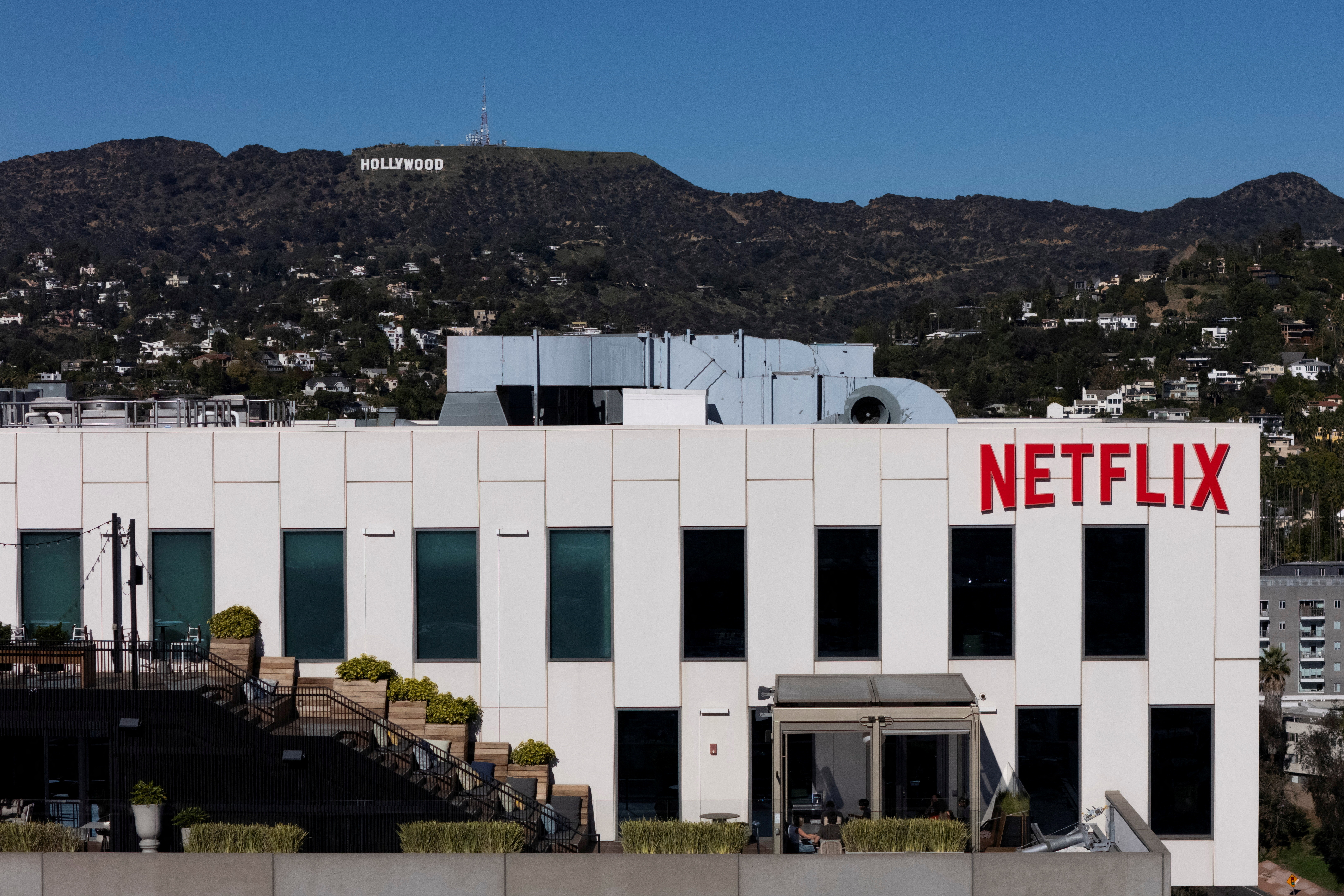 The Netflix CEO said the all-cash deal with expedite the timeline for a stockholder vote [File: Daniel Cole/Reuters]