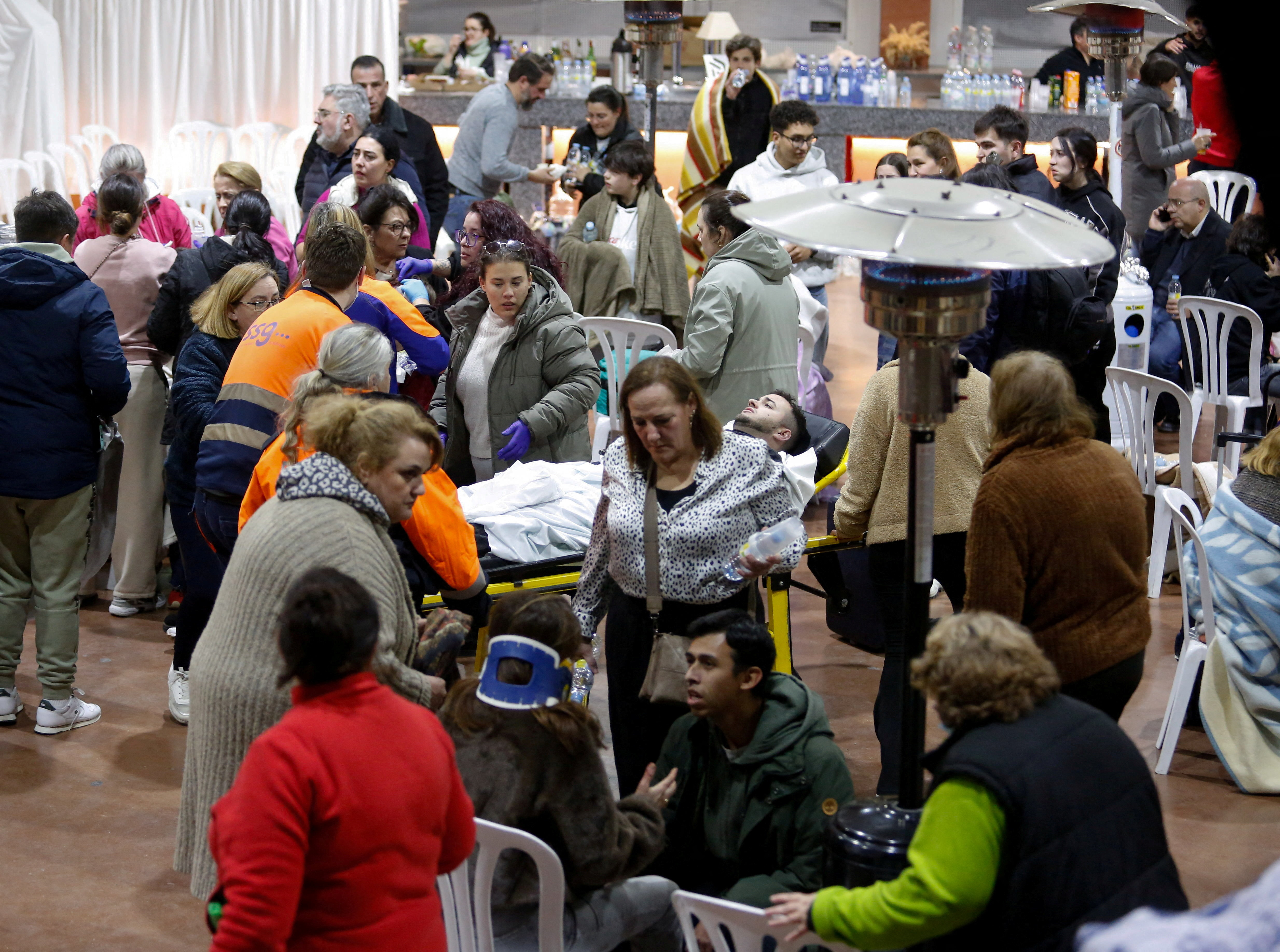 People affected by a deadly train derailment are transferred and treated at the Caseta Municipal in the town of Adamuz, after a high-speed train derailed and collided with another approaching train near Cordoba, Spain, January 18, 2026. REUTERS/Alex Gallegos TPX IMAGES OF THE DAY