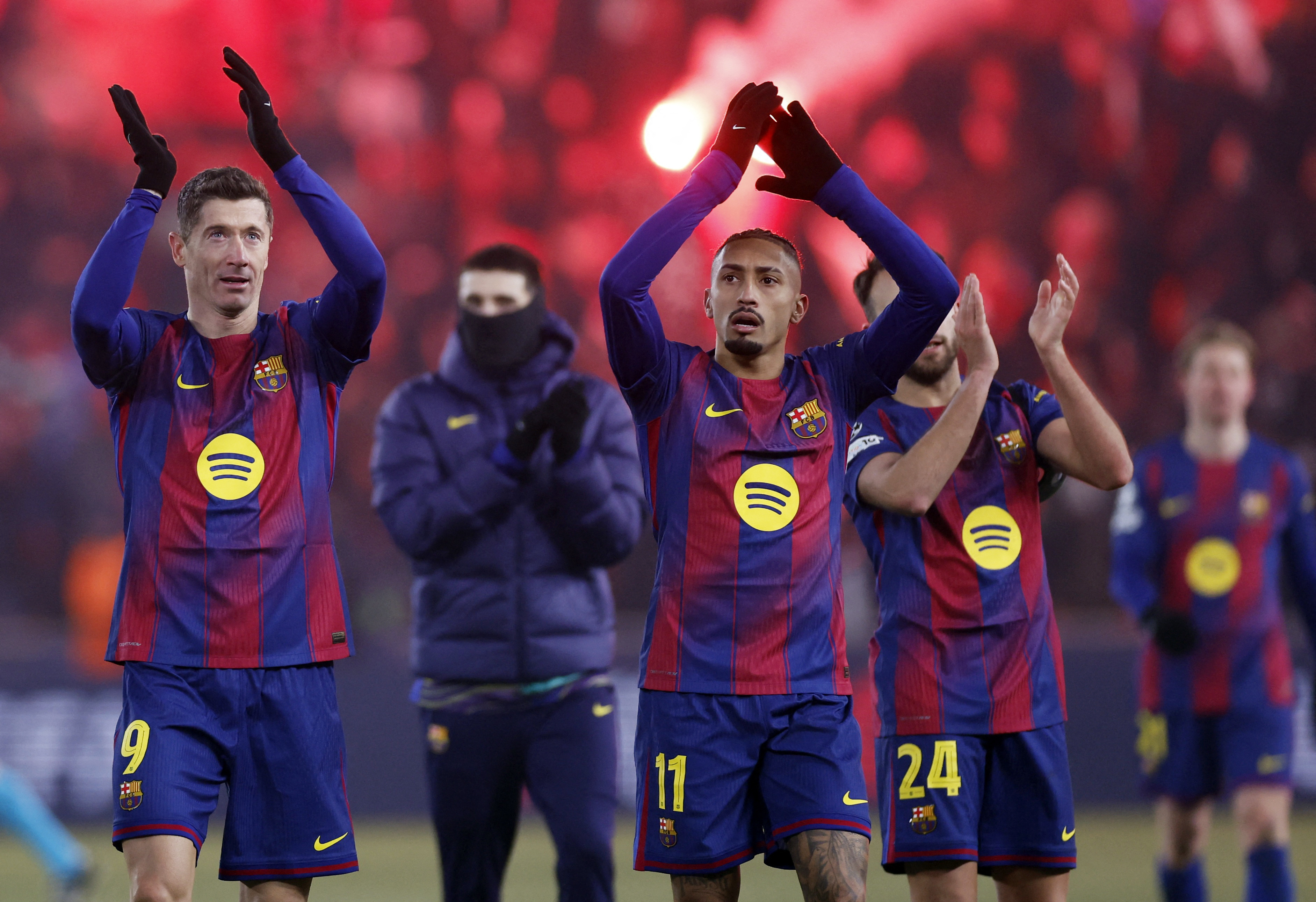 Barcelona's Robert Lewandowski and FC Barcelona's Raphinha celebrate after the UEFA Champions League match