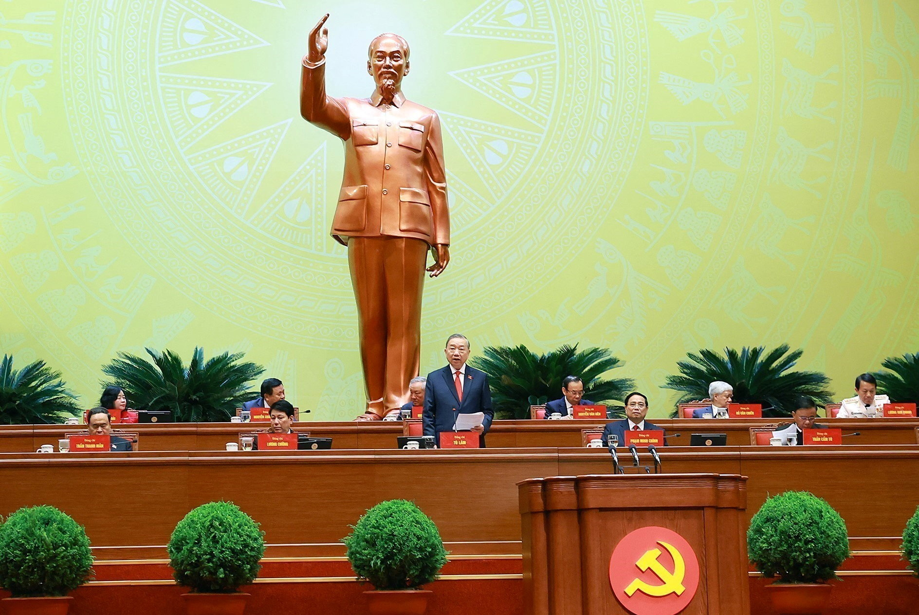Vietnam’s Communist Party General Secretary To Lam speaks in a chamber in front of a large statue of Ho Chi Minh.