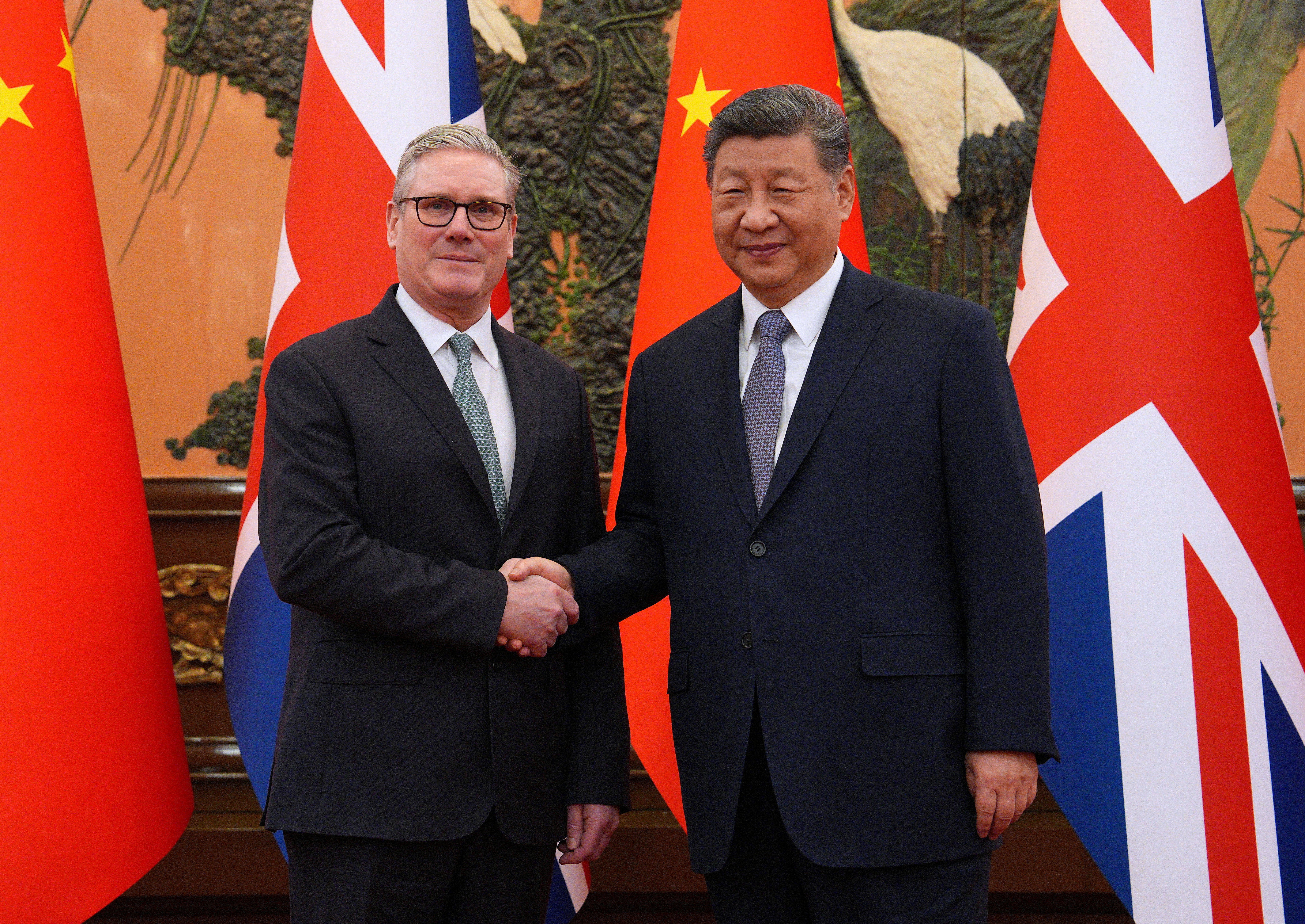 UK Prime Minister Keir Starmer shakes hands with Chinese President Xi Jinping in Beijing