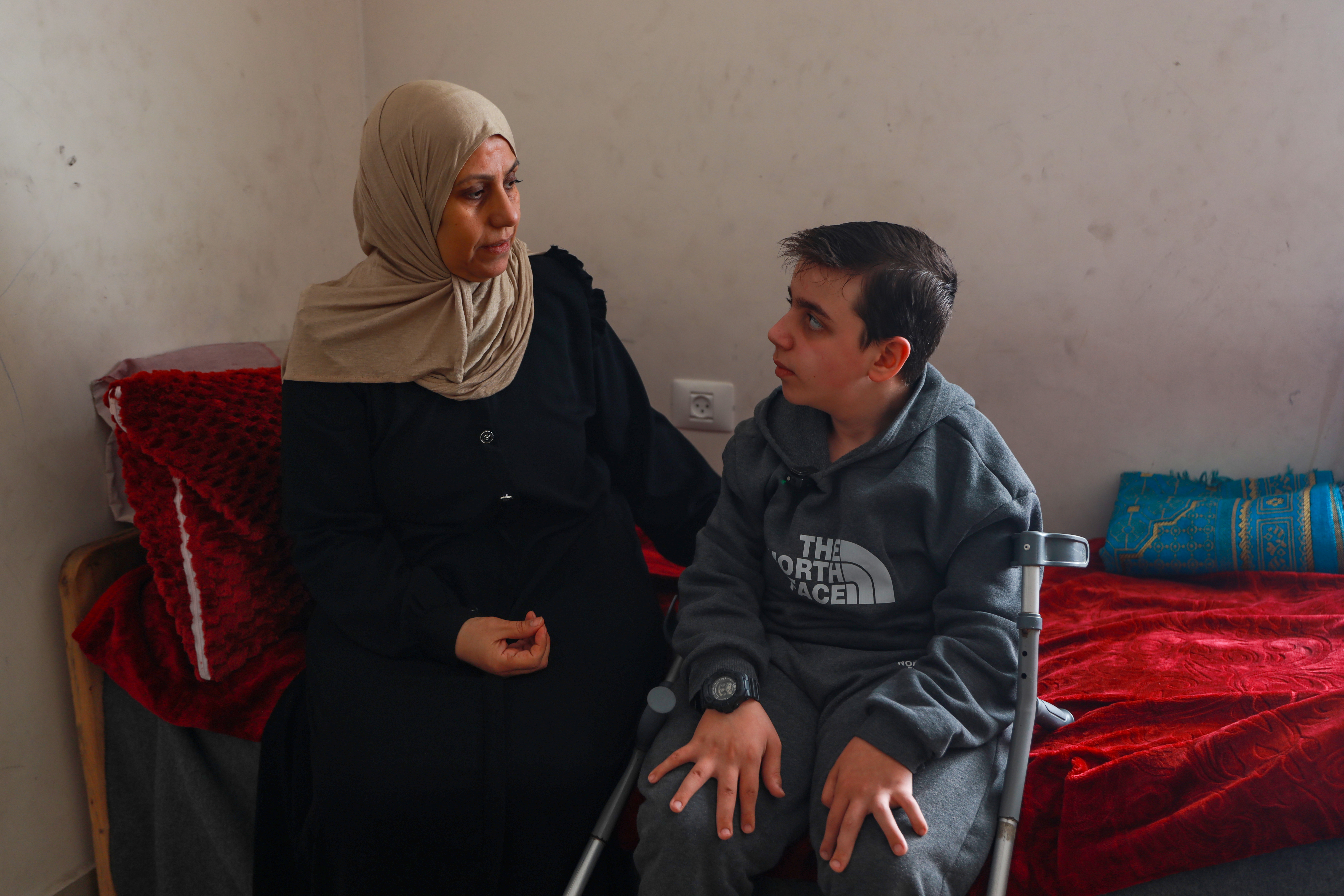 Khitam Hameed and her son Youssef, who suffers from a rare medical syndrome, wait for the Rafah crossing to open as soon as possible to reunite with the father, who left Gaza before the war