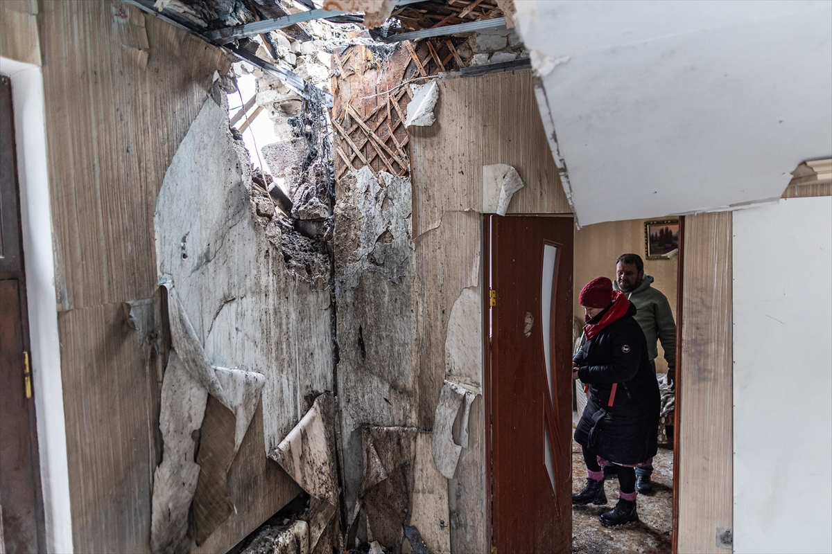 A woman in her damaged home after a Russian Shahed drone struck a residential area in Druzhkivka, Ukraine, 6 January 2026. Photojournalist:Diego Herrera Carcedo
