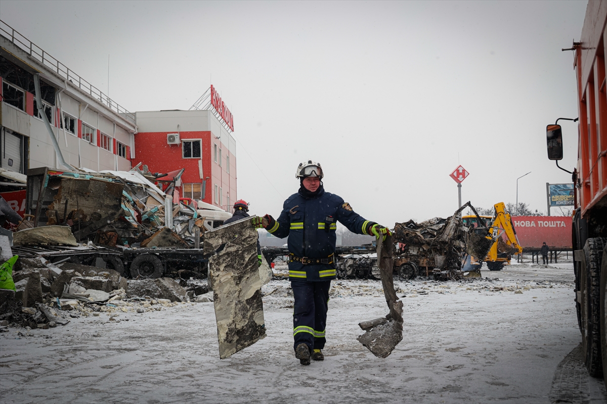 Ukrainian rescuers work at the site after a combined attack on the logistics terminal of the private company Nova Poshta in the village of Korotych, Kharkiv region, Ukraine on January 13, 2026. The strike by two Russian Iskander-M missiles and four Shahed attack drones killed four people and injured six more. Photojournalist:Stringer