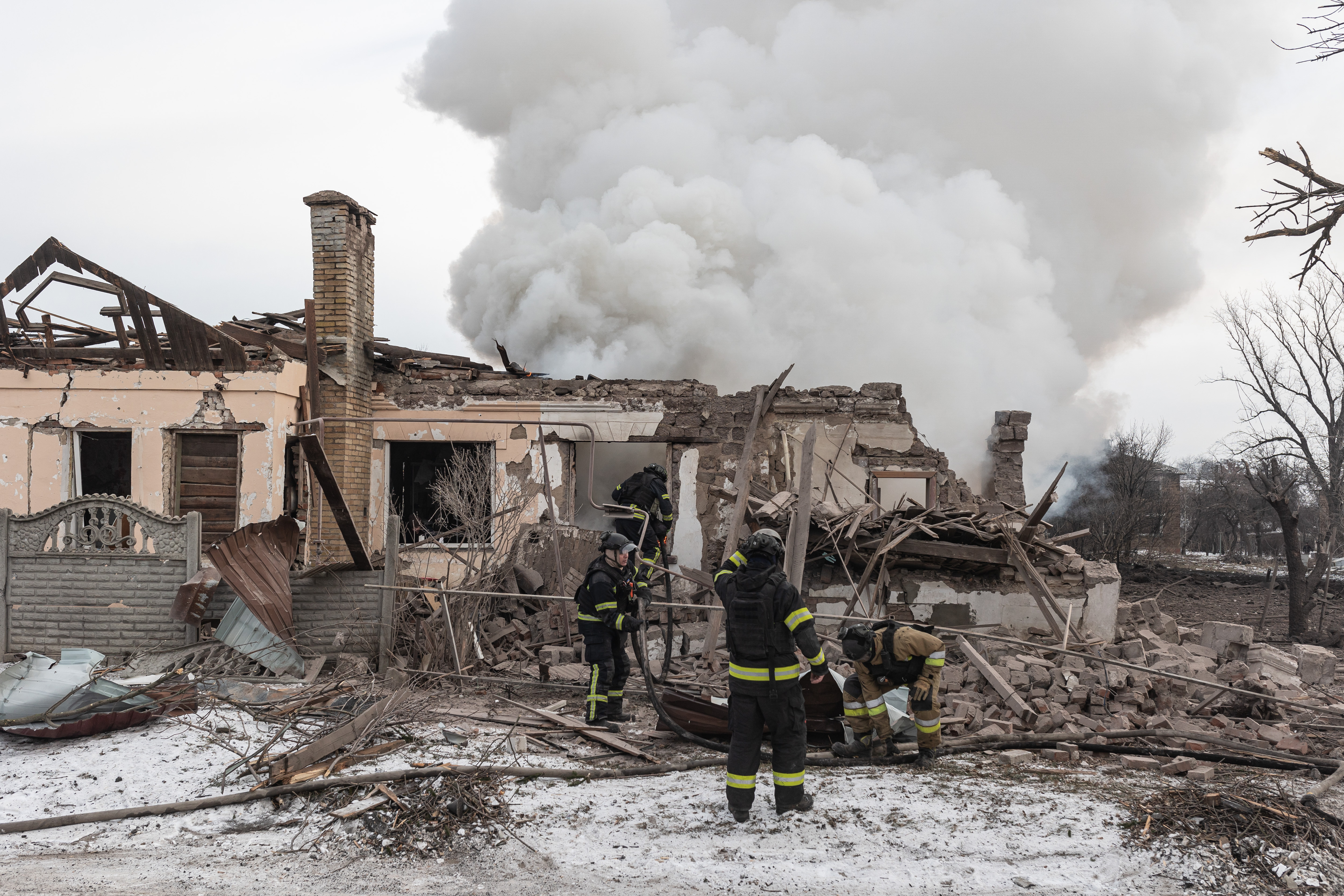 DRUZHKIVKA, UKRAINE - JANUARY 20: Ukrainian emergency crews intervene to put out a fire at a residential building after a Russian airstrike in the Druzhkivka district of Donetsk region, Ukraine on January 20, 2026. ( Diego Herrera Carcedo - Anadolu Agency )