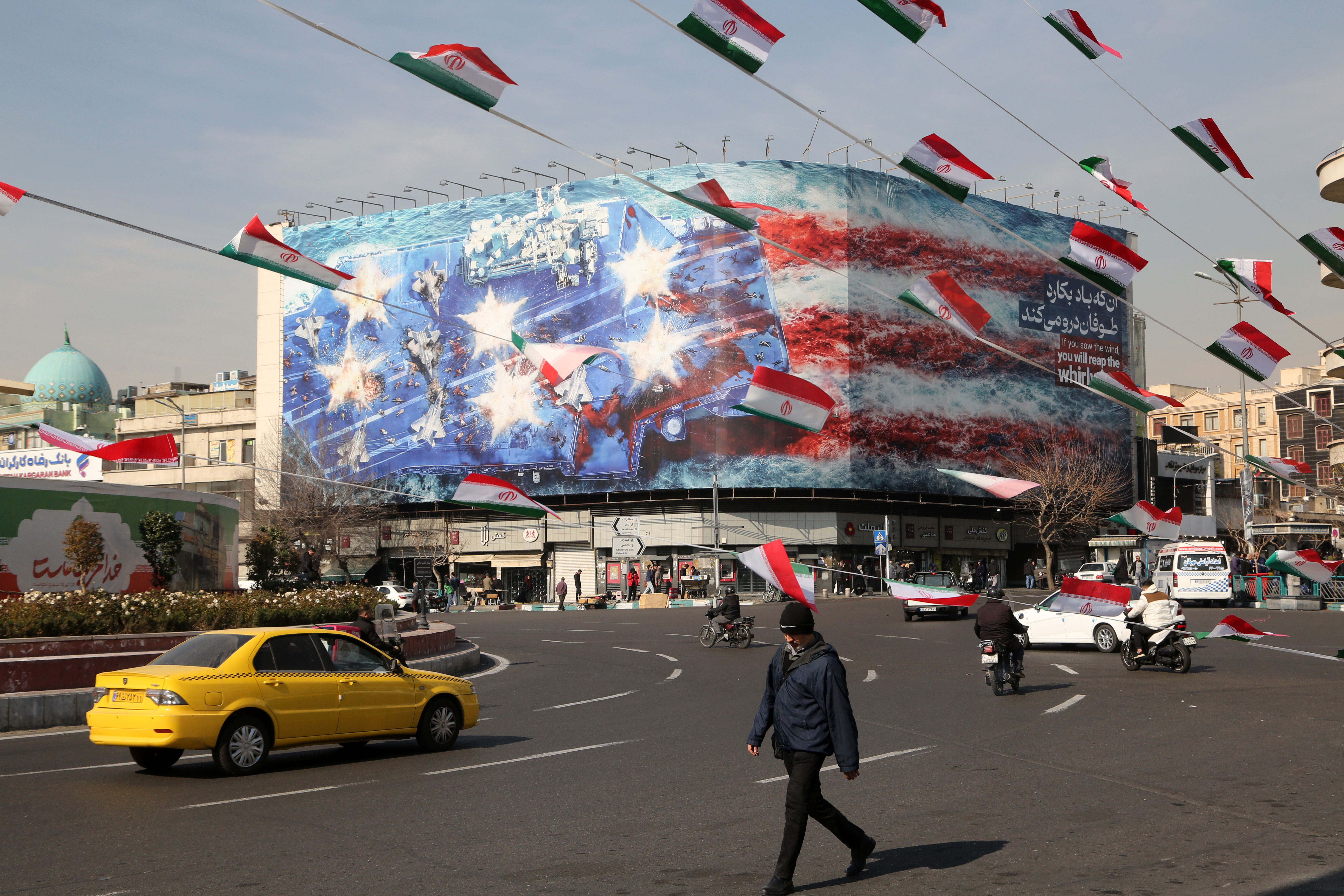 Anti-American posters and Iranian flags displayed in Tehran