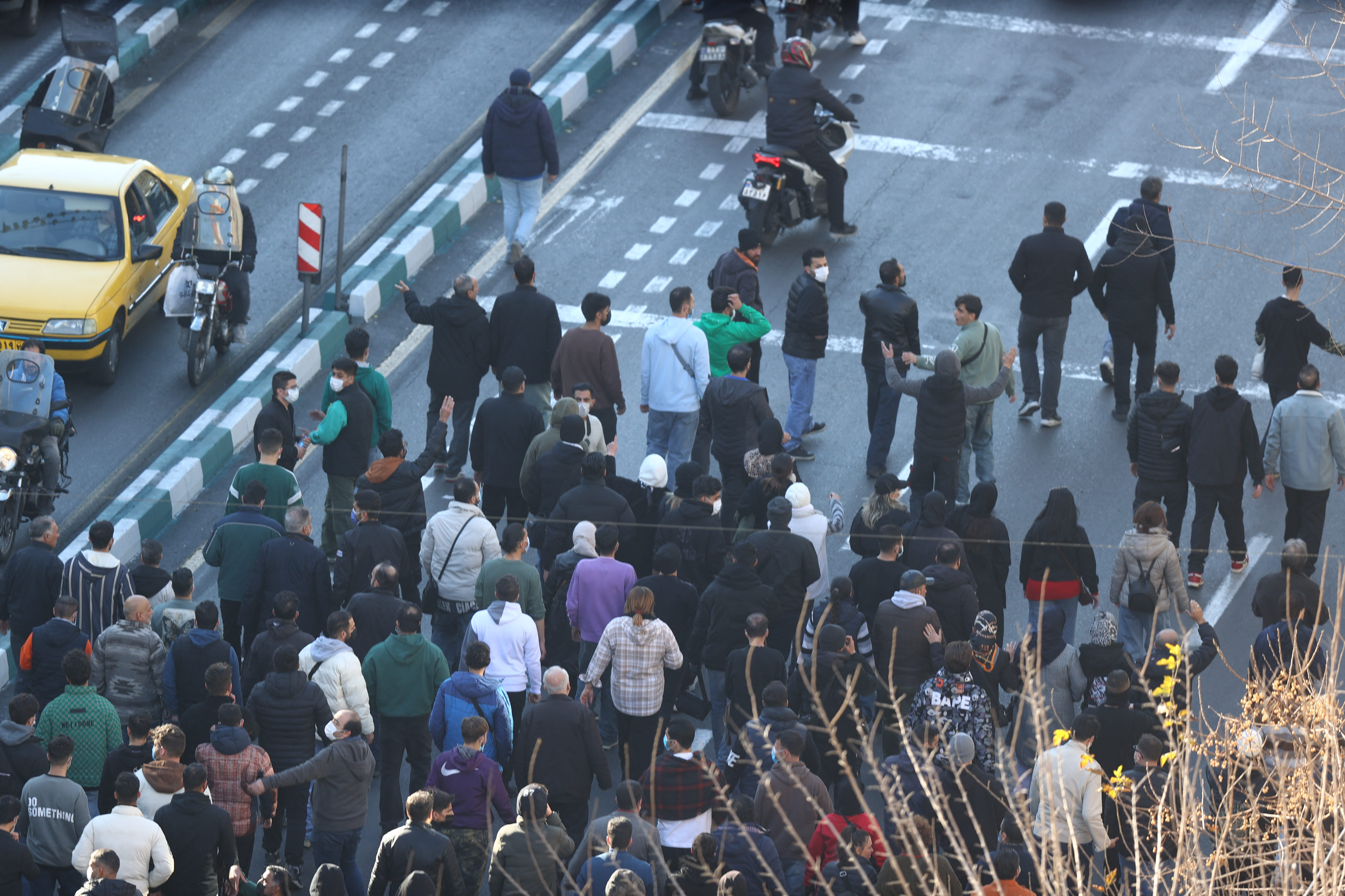 People march in protest in the streets.