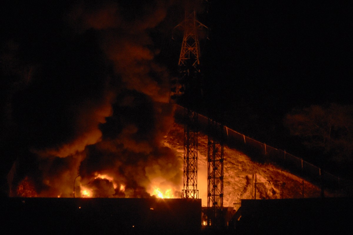 Picture of fire at Fuerte Tiuna, Venezuela's largest military complex, after a series of explosions in Caracas on January 3, 2026. Loud explosions, accompanied by sounds resembling aircraft flyovers, were heard in Caracas around 2:00 am (0600 GMT) on January 3, an AFP journalist reported. The explosions come as US President Donald Trump, who has deployed a navy task force to the Caribbean, raised the possibility of ground strikes against Venezuela.