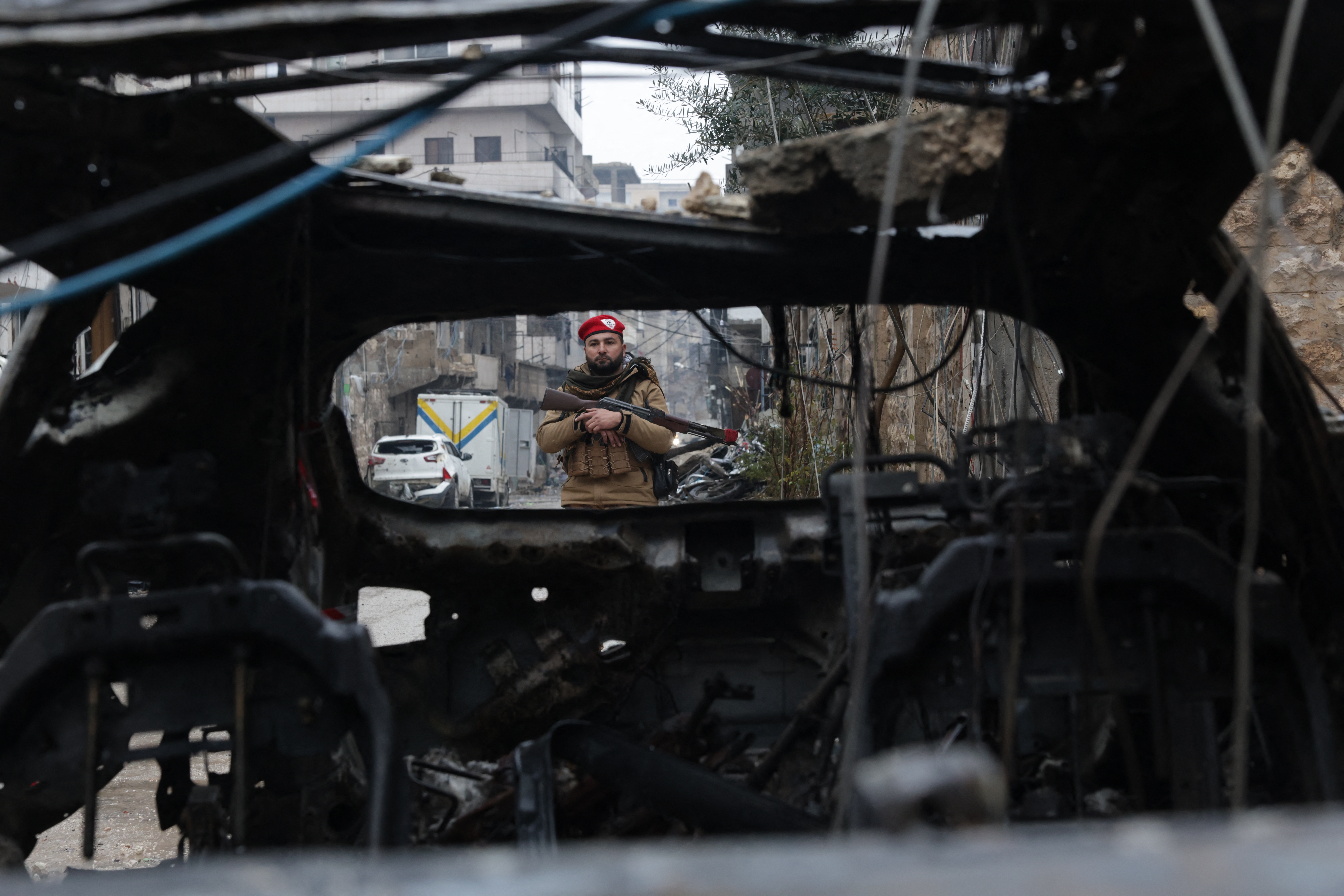 Syrians in Kurdish area of Aleppo pick up pieces after clashes