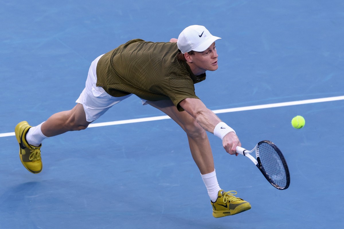 Italy's Jannik Sinner hits a shot against Italys Luciano Darderi during their men's singles match on day nine of the Australian Open tennis tournament in Melbourne on January 26, 2026. (Photo by IZHAR KHAN / AFP) / -- IMAGE RESTRICTED TO EDITORIAL USE - STRICTLY NO COMMERCIAL USE --