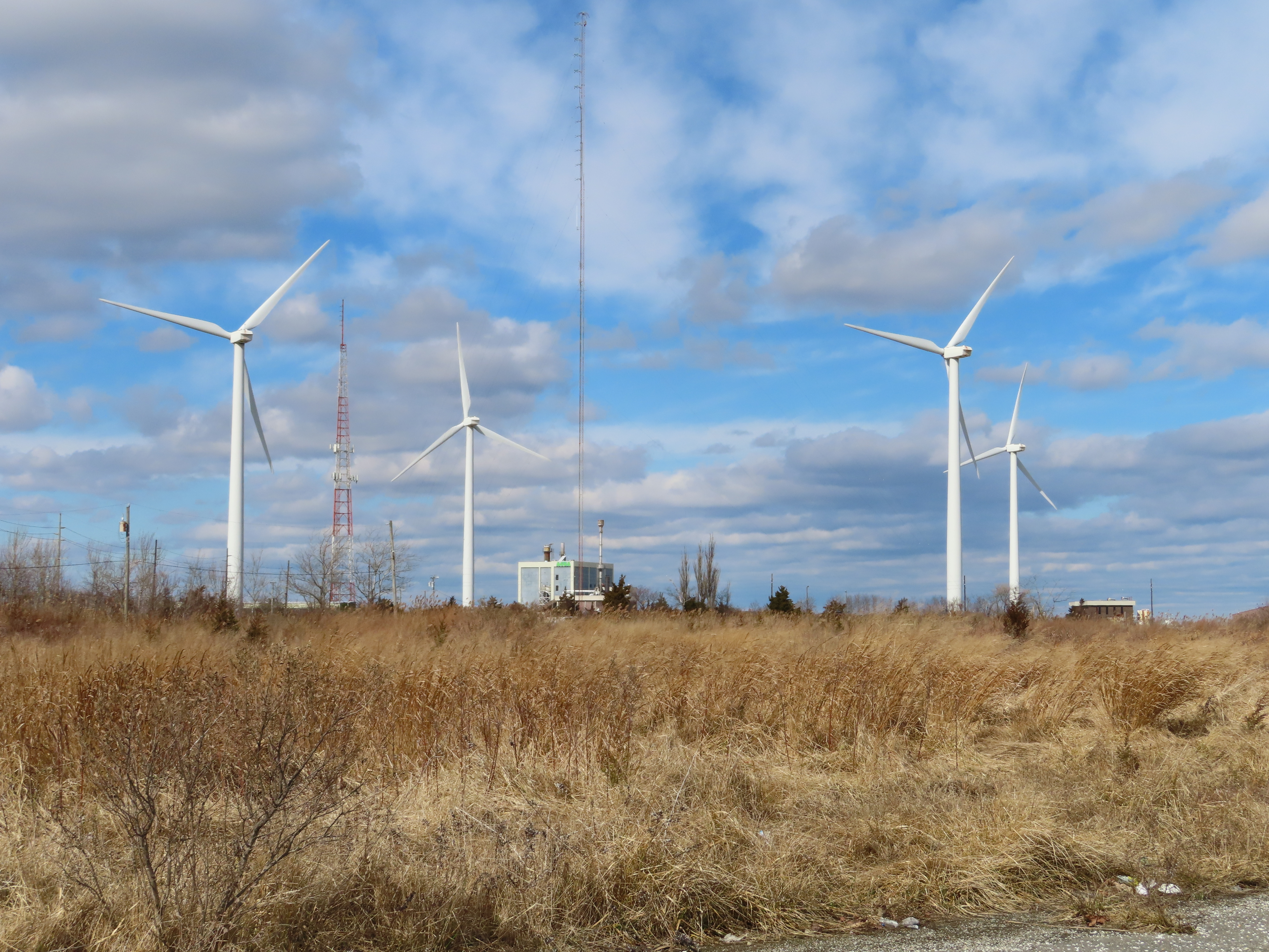 Windmills against the backdrop of a cloudy sky.