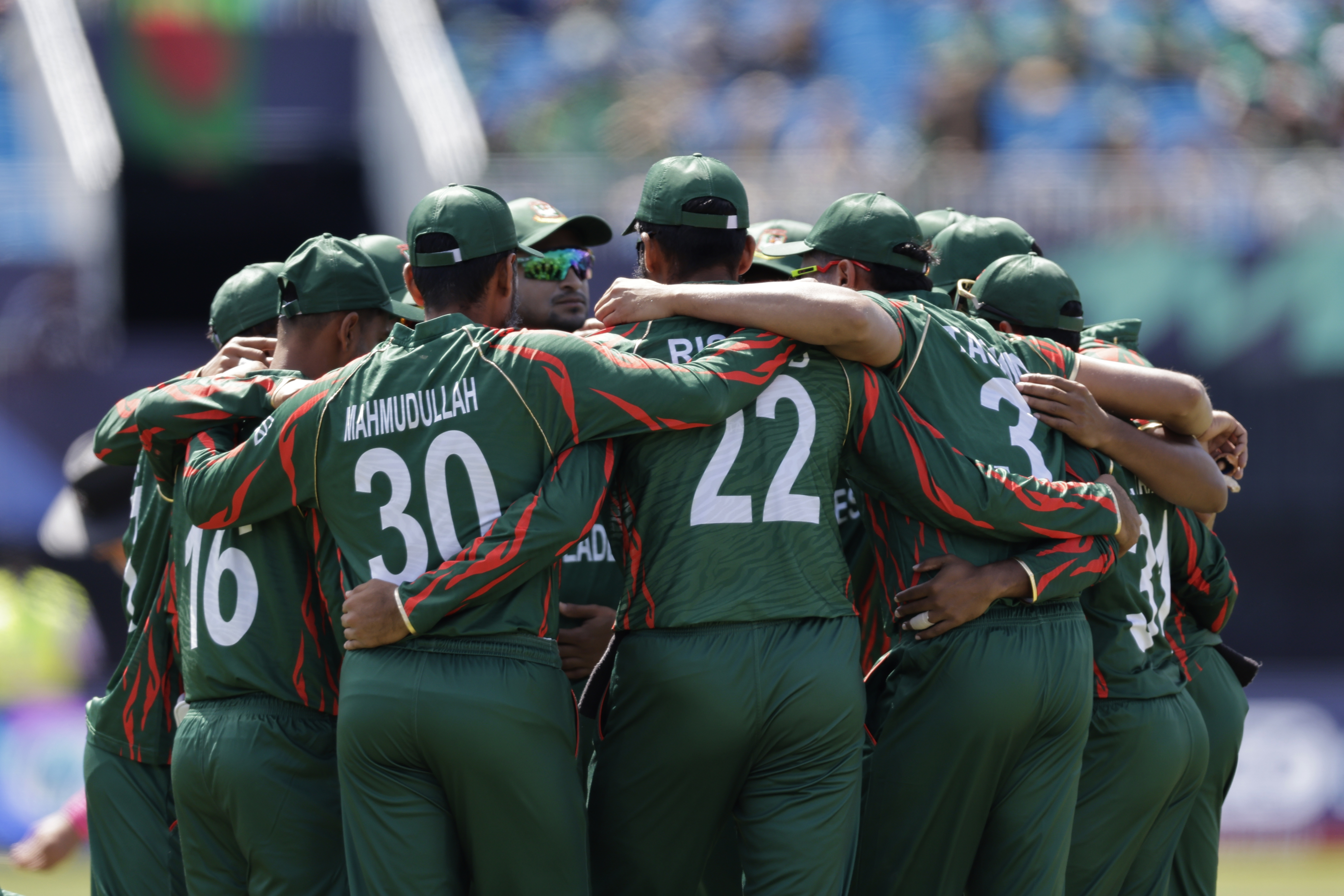 Bangladesh players huddle before the start of a match.