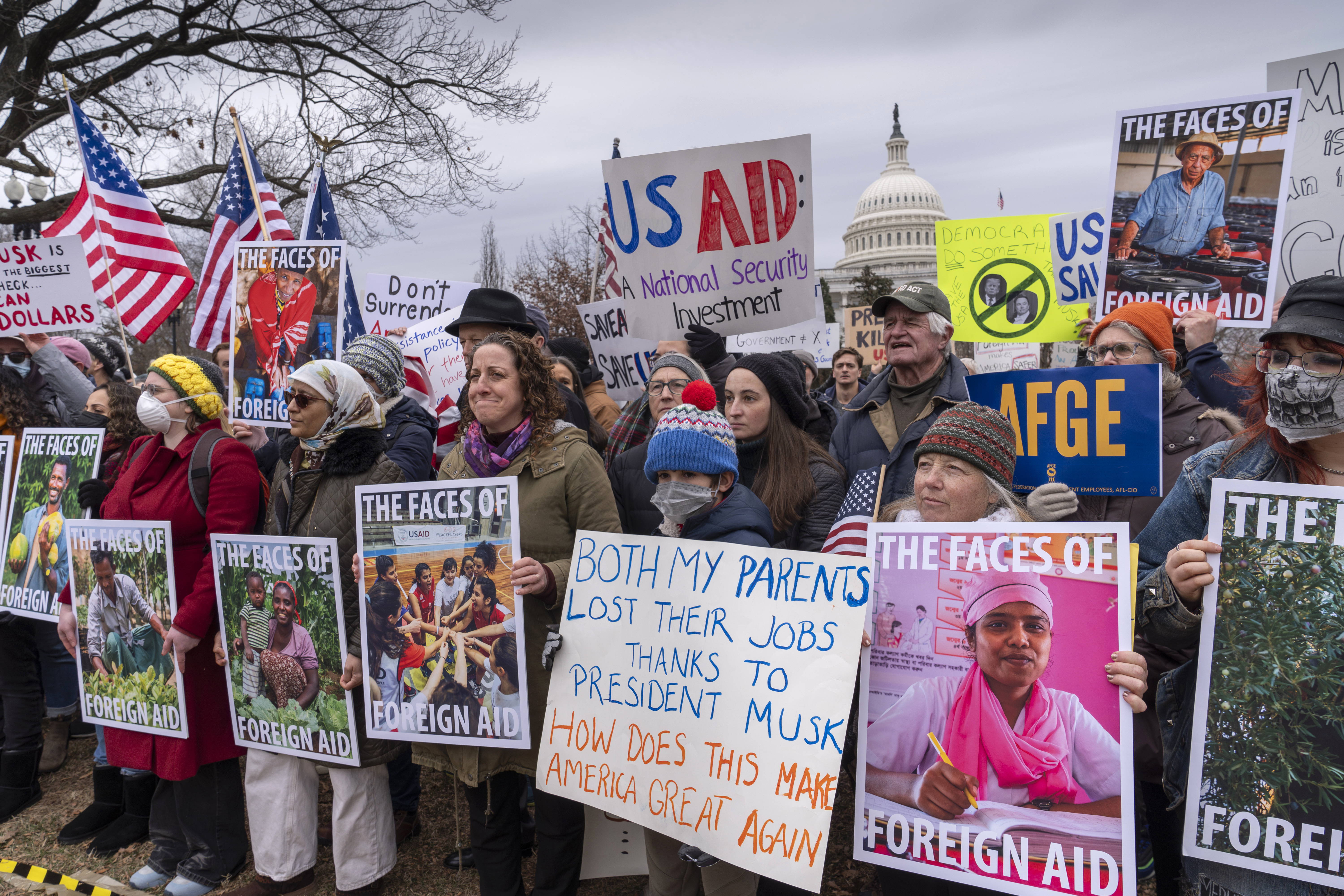 Protesters in front of the Capitol protest in support of USAID