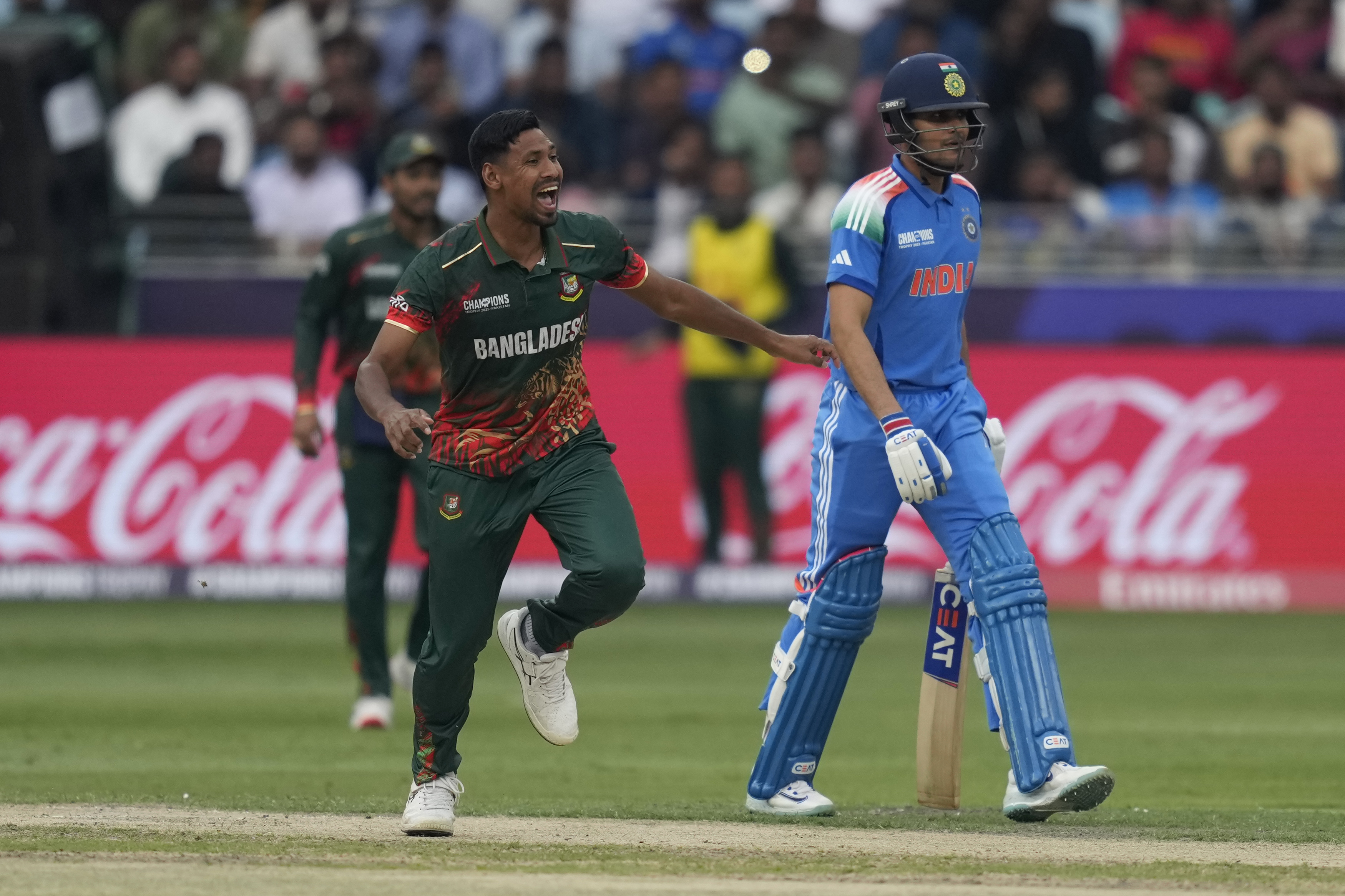 Bangladesh's Mustafizur Rahman reacts after bowling a delivery.