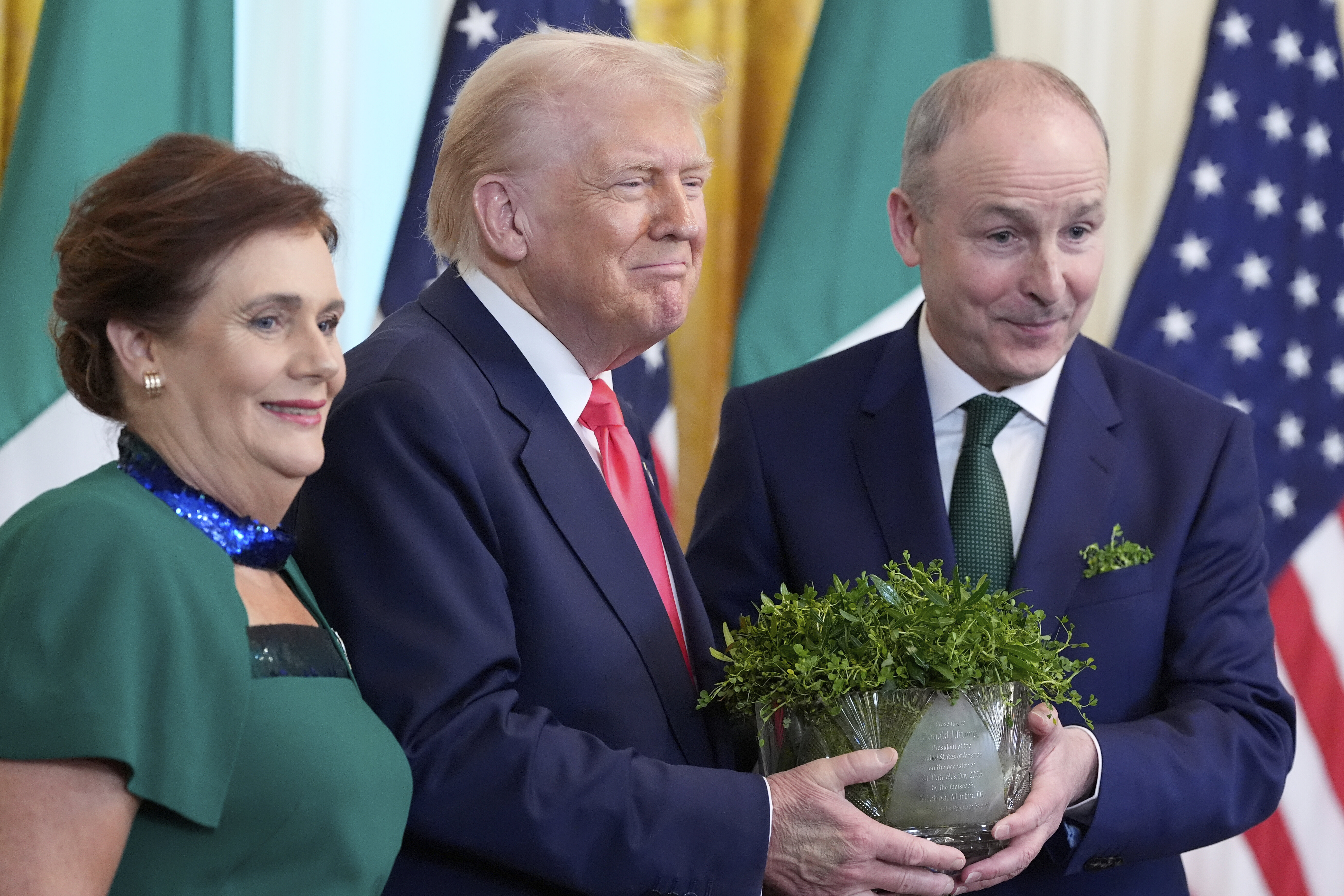 Micheal Martin and Donald Trump cradle a bowl of clovers