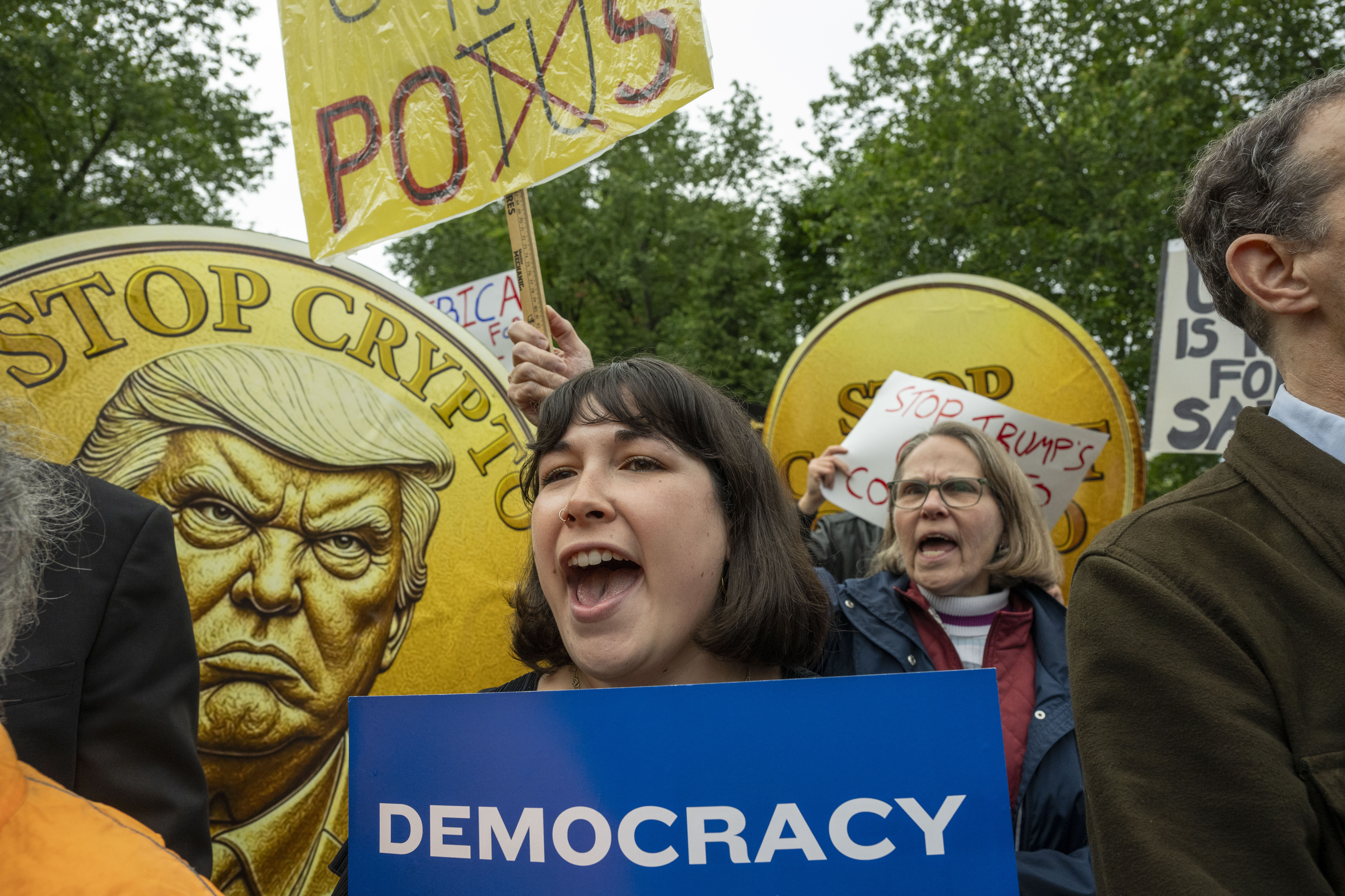 Protesters demonstrate against Trump's crypto currency ties