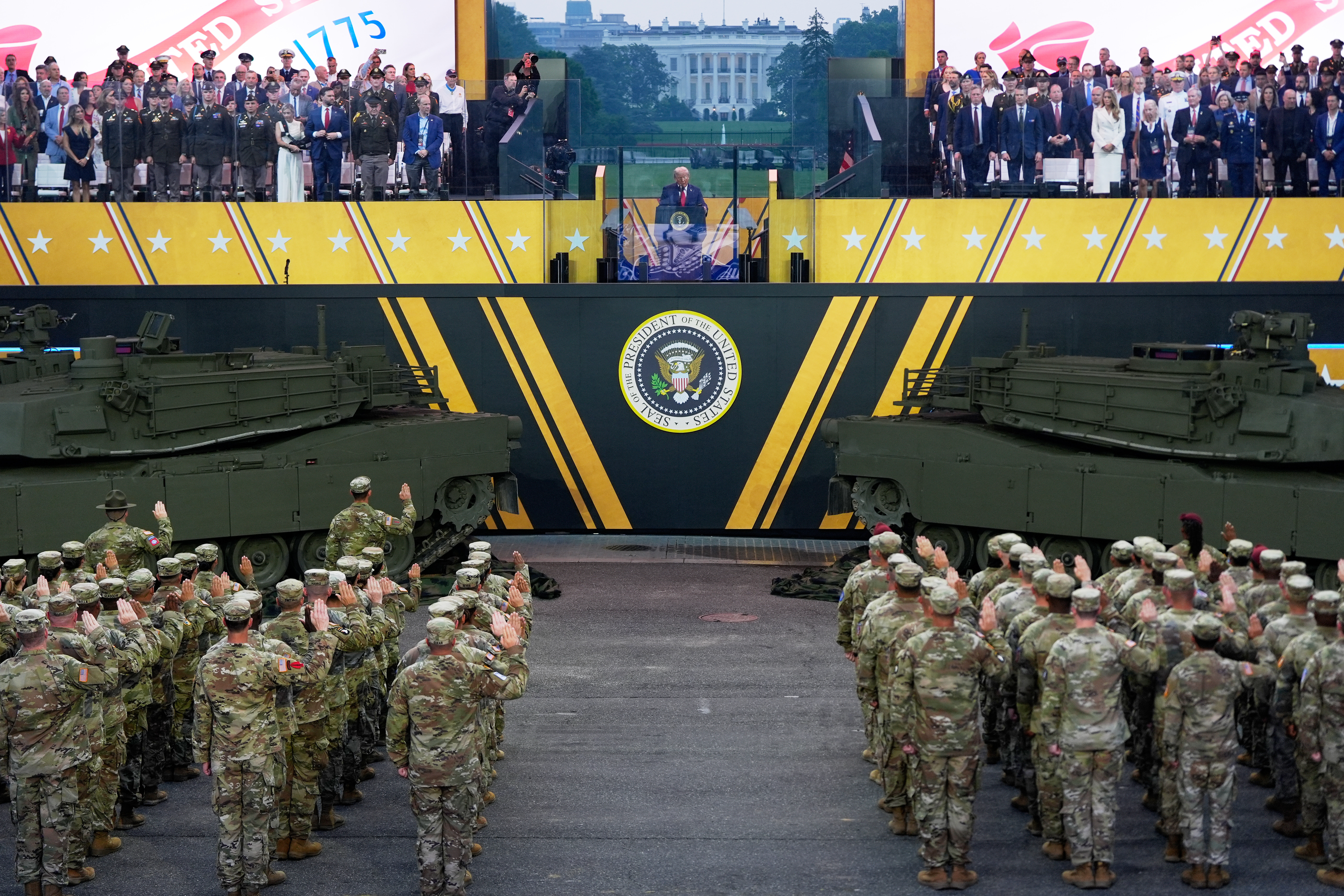 Soldiers salute Trump at a military parade