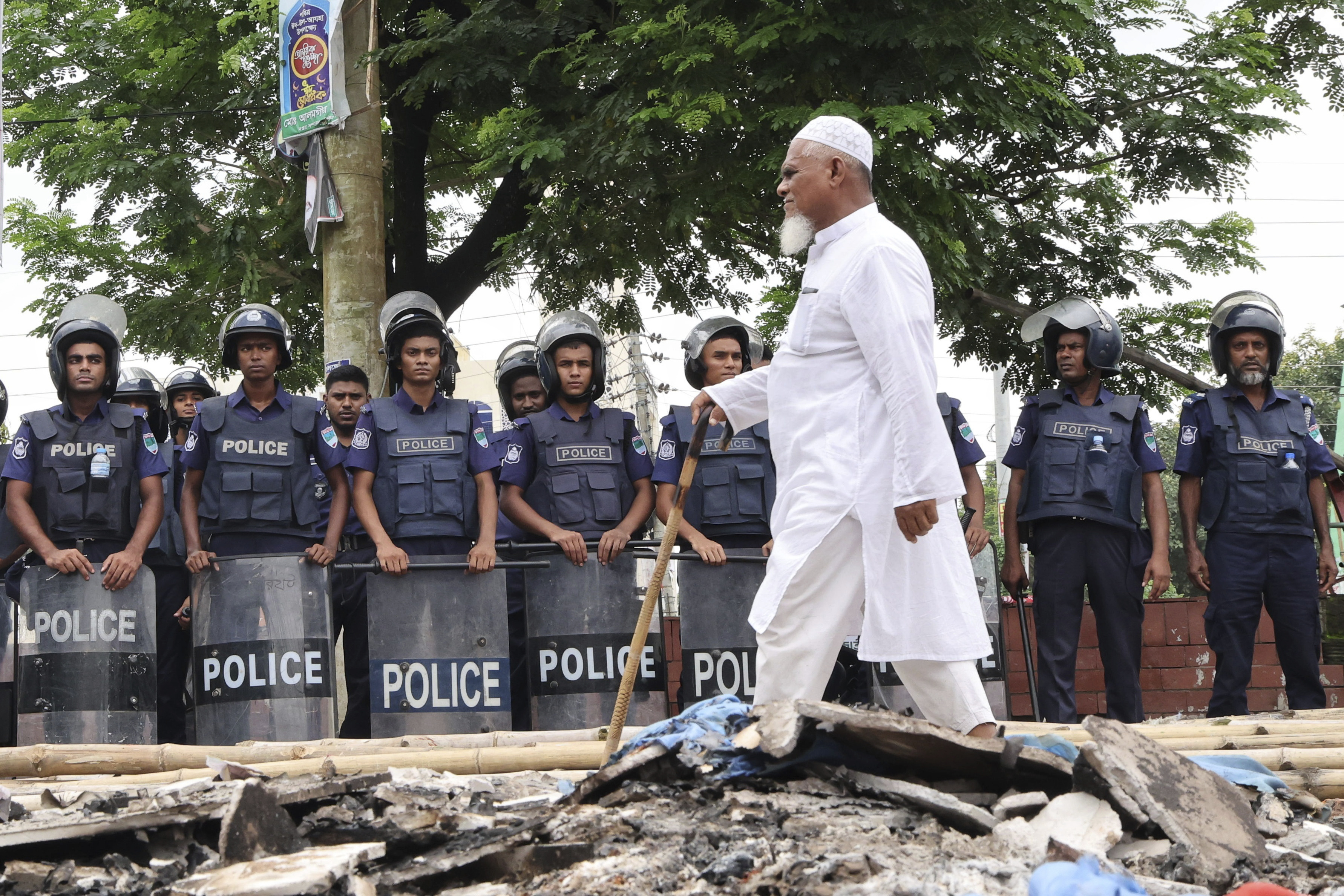 A man walks past a police cordon.