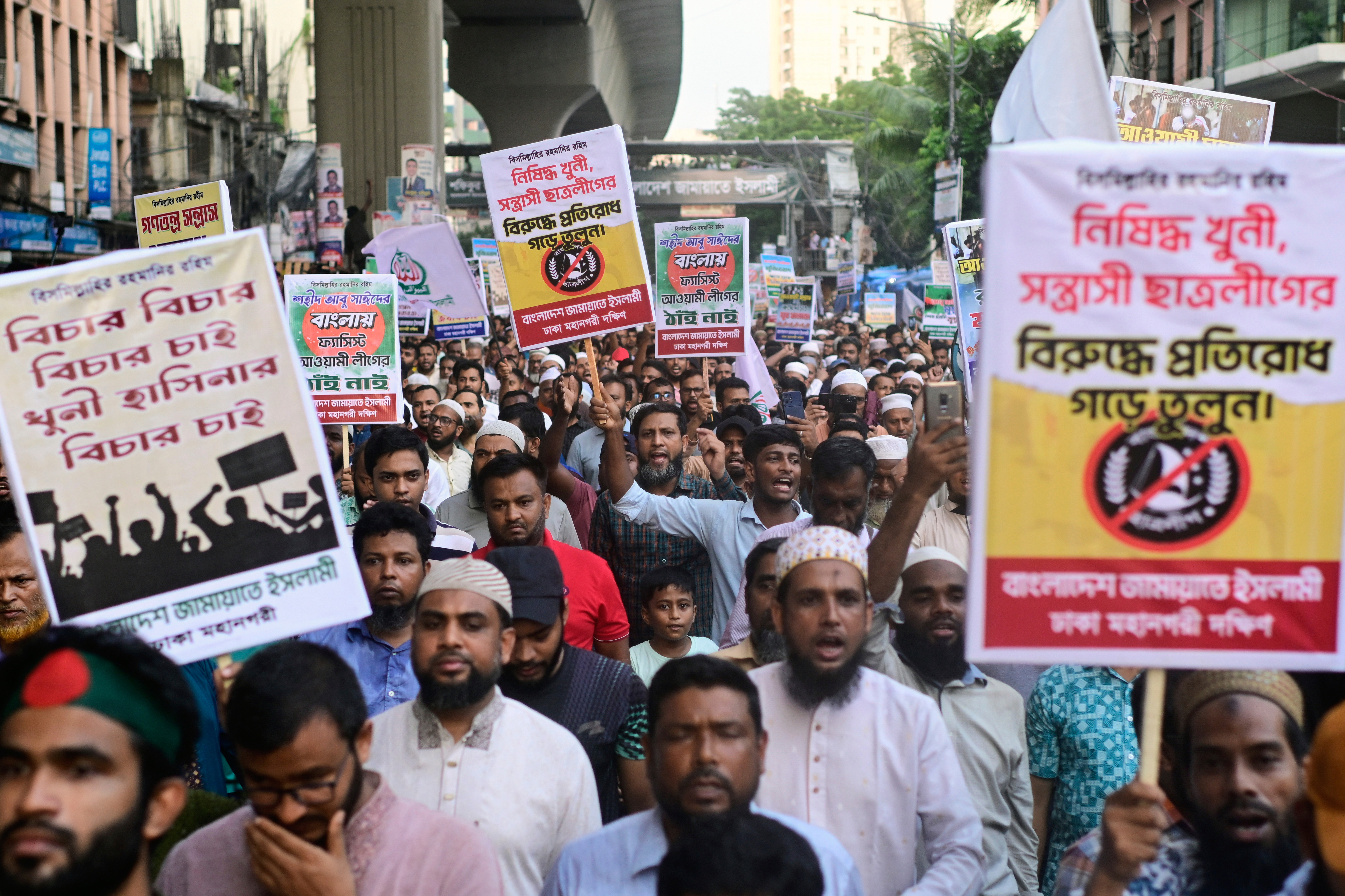 Jamaat-e-Islami activists condemn Wednesday's attack in Gopalganj on National Citizen Party (NCP) leaders by supporters of the ousted Prime Minister Sheikh Hasina, during a protest in front of Baitul Mukarram National Mosque in Dhaka, Bangladesh, Thursday, July 17, 2025. (AP Photo/Mahmud Hossain Opu)