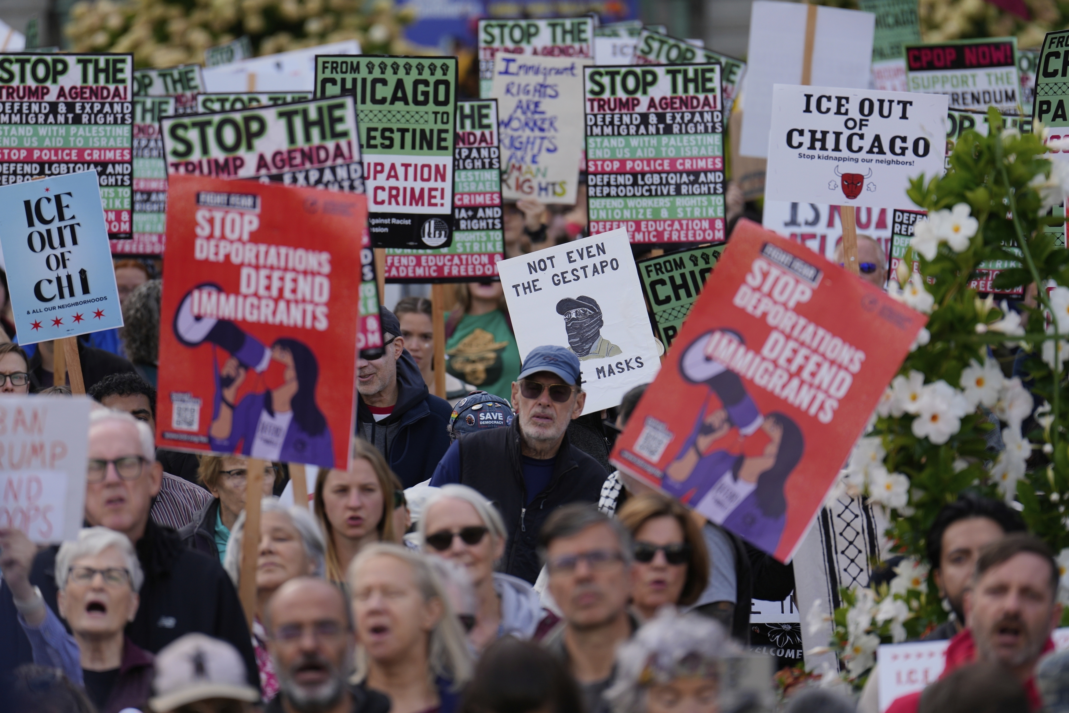 Protesters call for an end to federal action in Chicago.