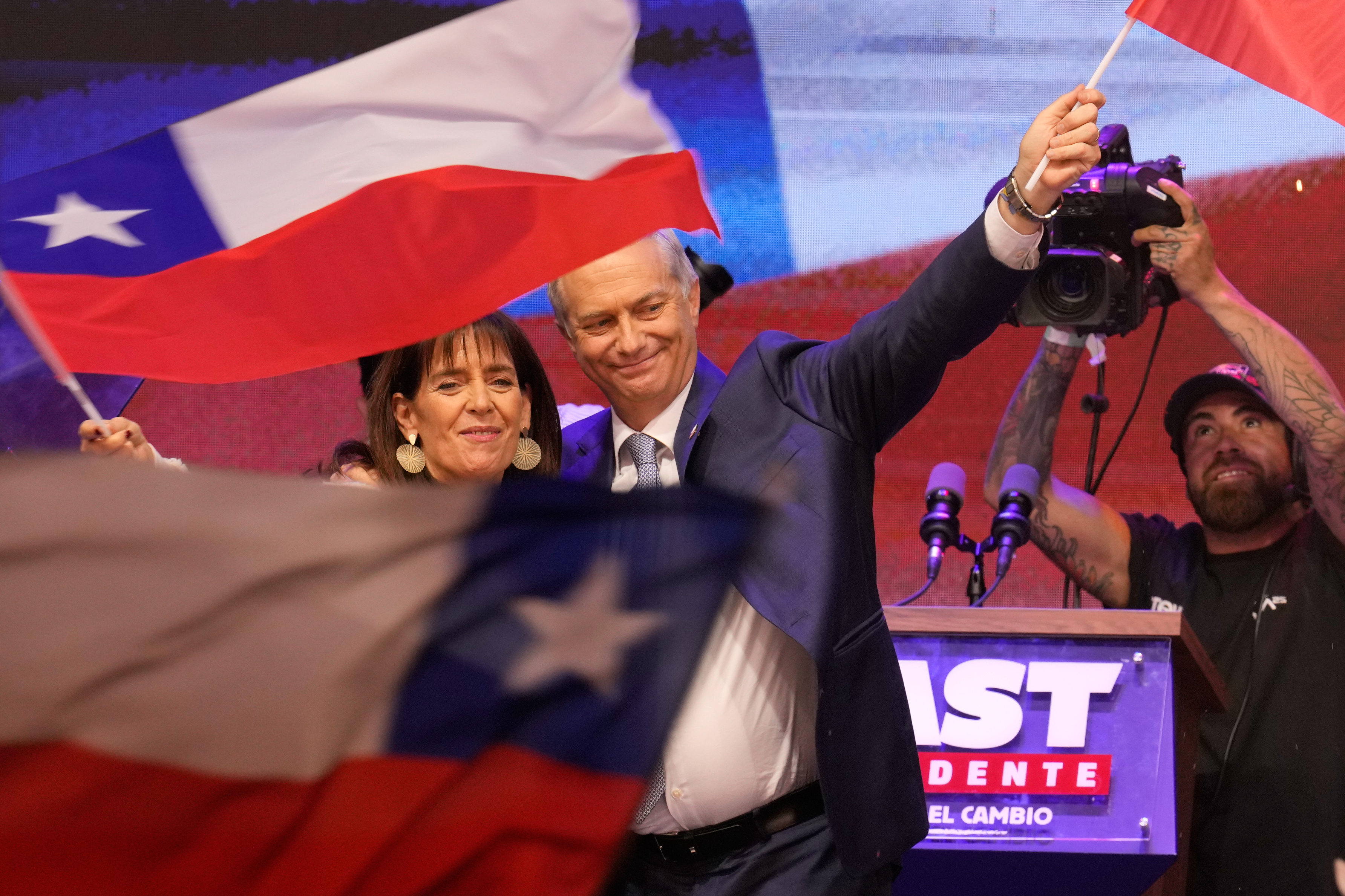 Jose Antonio Kast celebrates amid a sea of Chilean flags