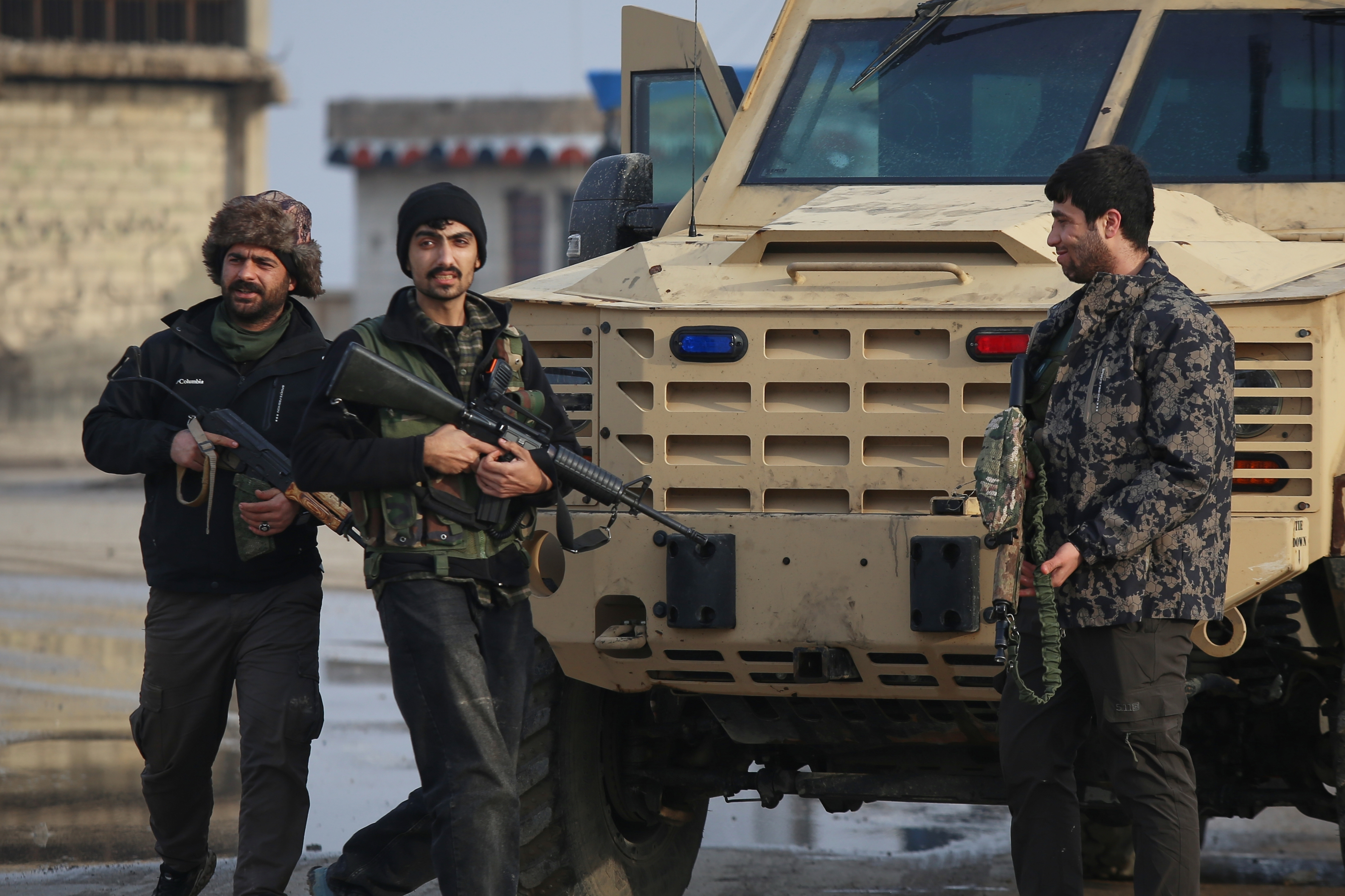 Kurdish fighters with the Syrian Democratic Forces (SDF) prepare to head towards the front line before the end of a four-day truce with the Syrian government in Hasakah, northeastern Syria, Saturday, January 24, 2026 [Baderkhan Ahmad/AP]