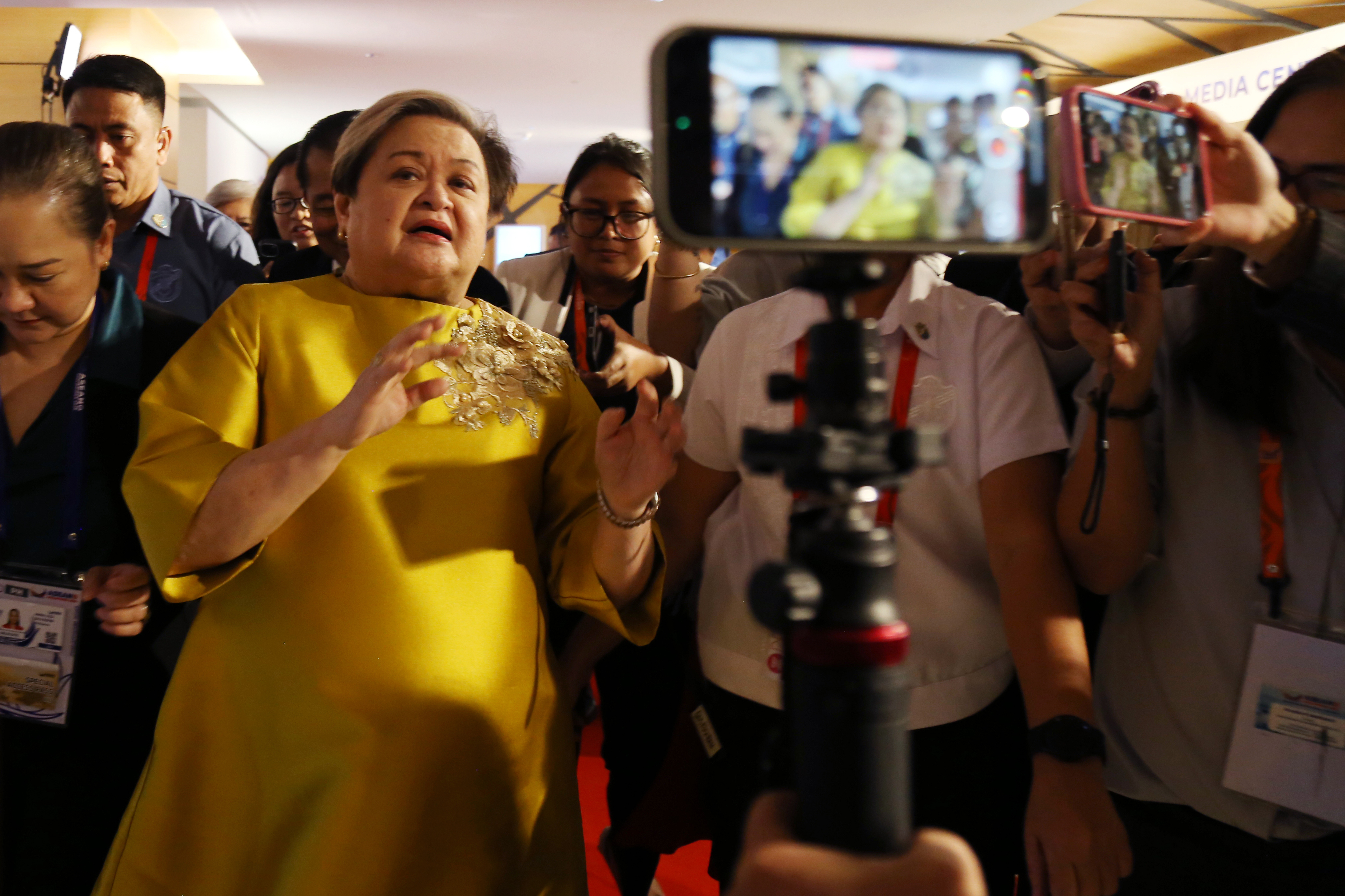 Philippine Foreign Secretary Theresa Lazaro, front left, is surrounded by the media after a press conference on the ASEAN Foreign Ministers' Meeting Retreat in Cebu, Philippines, Thursday, Jan. 29, 2026. (AP Photo/Jacqueline Hernandez)