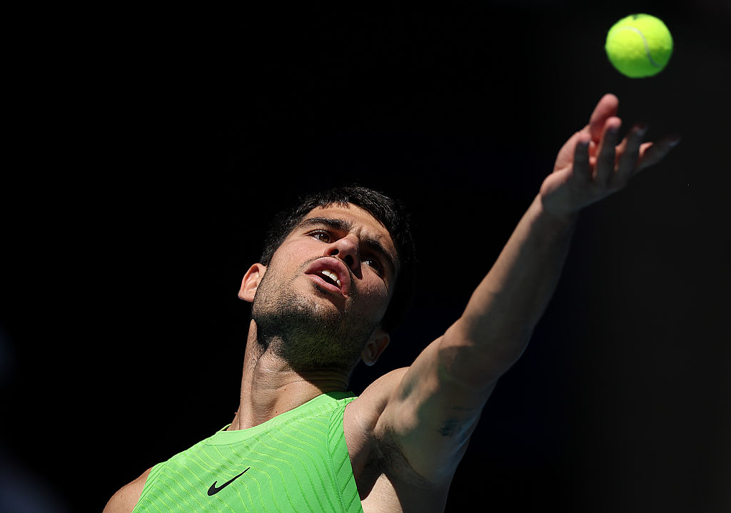 Carlos Alcaraz of Spain serves against Corentin Moutet of France in the Men's Singles Third Round during day six of the 2026 Australian Open