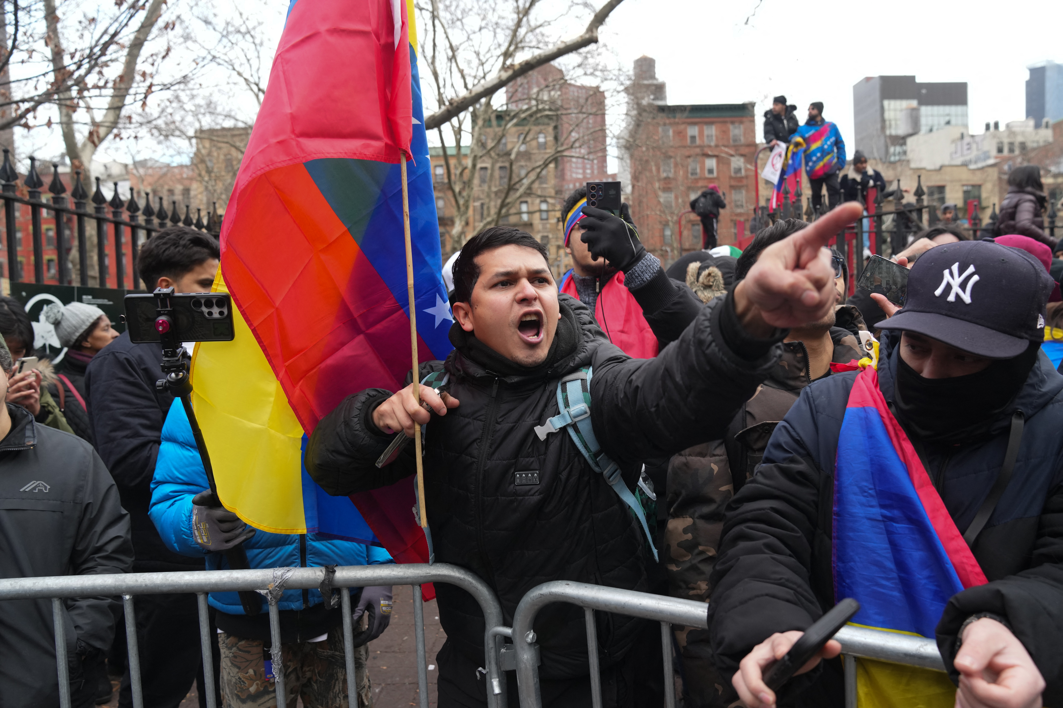 A supporter of the arrest of ousted Venezuelan president Nicolas Maduro shouts outside the Daniel Patrick Moynihan United States Courthouse after Maduro attended his arraignment hearing on January 5, 2026 in New York.
